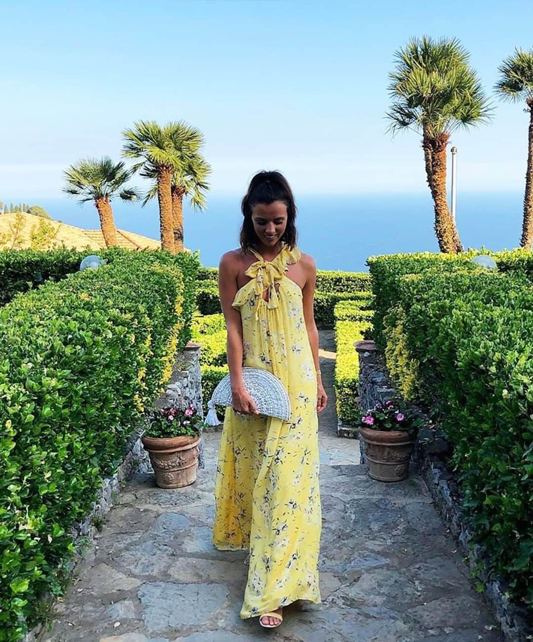 アクセサライズのインスタグラム：「A snapshot of summer☀️, @lucymeck1 Italian look is accompanied by our crystal-embellished tassel clutch bag. Covered with gems that reflect the sun, it's a must-have for your summer getaway. Sold out online but available in store!  Tap the link in the bio to shop clutch bags now.  #Accessorize #Accessorizer」