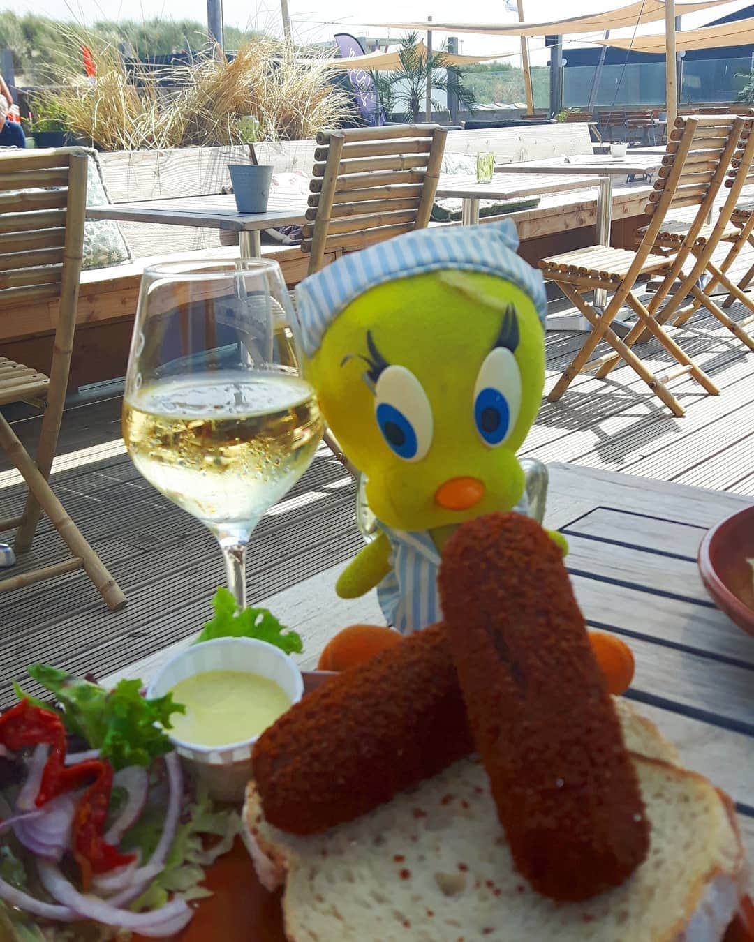 Little Yellow Birdさんのインスタグラム写真 - (Little Yellow BirdInstagram)「Sunday lunch and I'm enjoying the absolute highlight, the pinnacle of Dutch cuisine: the "kroket". #littleyellowbird #tweety #tweetykweelapis #adventures #yellow #bird #weekend #sunday #sundaylunch #kroket #mustard #ijmuiden #zandiego #beach #strand #sun #fun #netherlands #dutchcuisine #wine #whitewine #goodfood #food #stuffedanimalsofinstagram #plushiesofinstagram」6月30日 22時36分 - tweetykweelapis