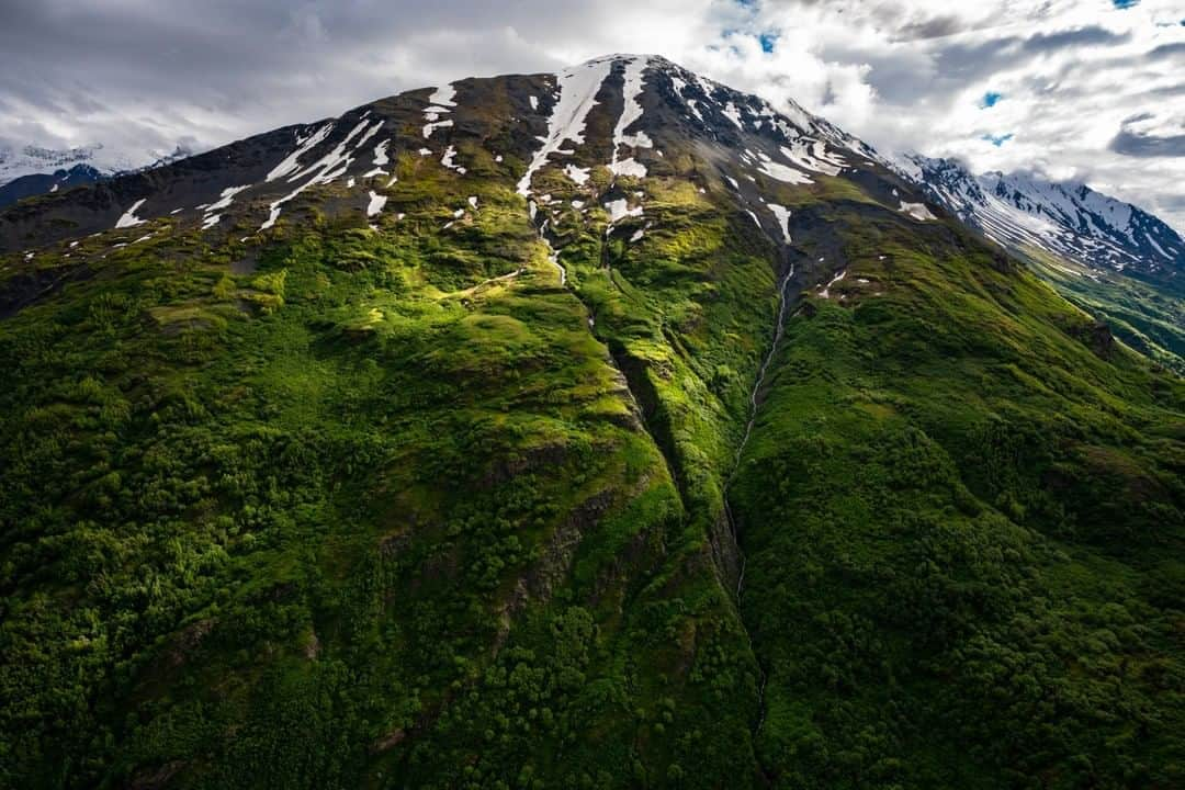 National Geographic Travelさんのインスタグラム写真 - (National Geographic TravelInstagram)「Photo by @cristinamittermeier | A dynamic landscape greets you when you fly into Alaska's Katmai National Park and Preserve. These lands are magnificent in their wildness. There is a beauty here that most people only read about in stories—a place where you can find a jagged spine of fourteen active volcanic mountains and crystal clear rivers flowing down from snowcapped peaks out to sea. Within these rivers, millions upon millions of salmon return every year to feed the densest populations of brown bears in the world. Follow me, @cristinamittermeier, to see images of this ecosystem at work. #aerial #mountains #alaska」7月1日 1時01分 - natgeotravel