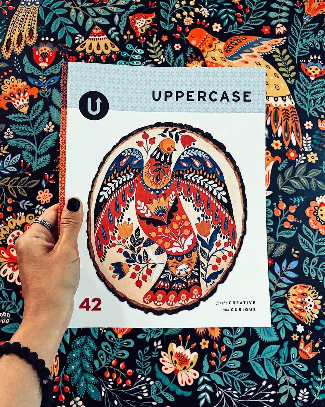 Dinara Mirtalipovaのインスタグラム：「Have you seen the recent cover art for #Uppercase42 @uppercasemag ? 😊 It is dedicated to Folk Art and my Birdie is proudly featured! 😊 I’m a humble, modest person who otherwise refrains from bragging, but I have to say this is the time I feel a wide range of emotions, I feel grateful, thankful, I feel accomplished. I pinch myself to know this is true.  This issue is filled with amazing stories and artist features - if you haven’t subscribed yet, please consider doing so, as this way you are supporting an independed publisher and all the artists who have been contributing their art to the magazine for years. I’m going to flip through pages later in my stories and will share my interview spread too. Big thanks to Janine for all her hard work and dedication to @uppercasemag ❤️ #folkart #dinaramirtalipova #mirdinara #uppercasemagazine」