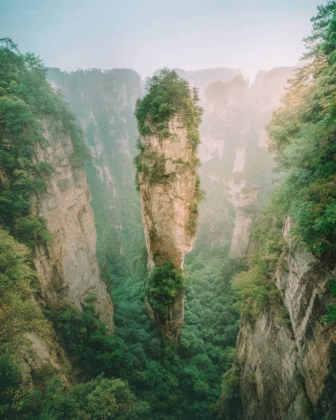 Travel + Leisureさんのインスタグラム写真 - (Travel + LeisureInstagram)「Have you ever seen anything like these stone pillars? Tag a friend you'd want to visit Zhangjiajie National Forest Park with! #tlpicks courtesy of @iw.wm」7月17日 2時36分 - travelandleisure