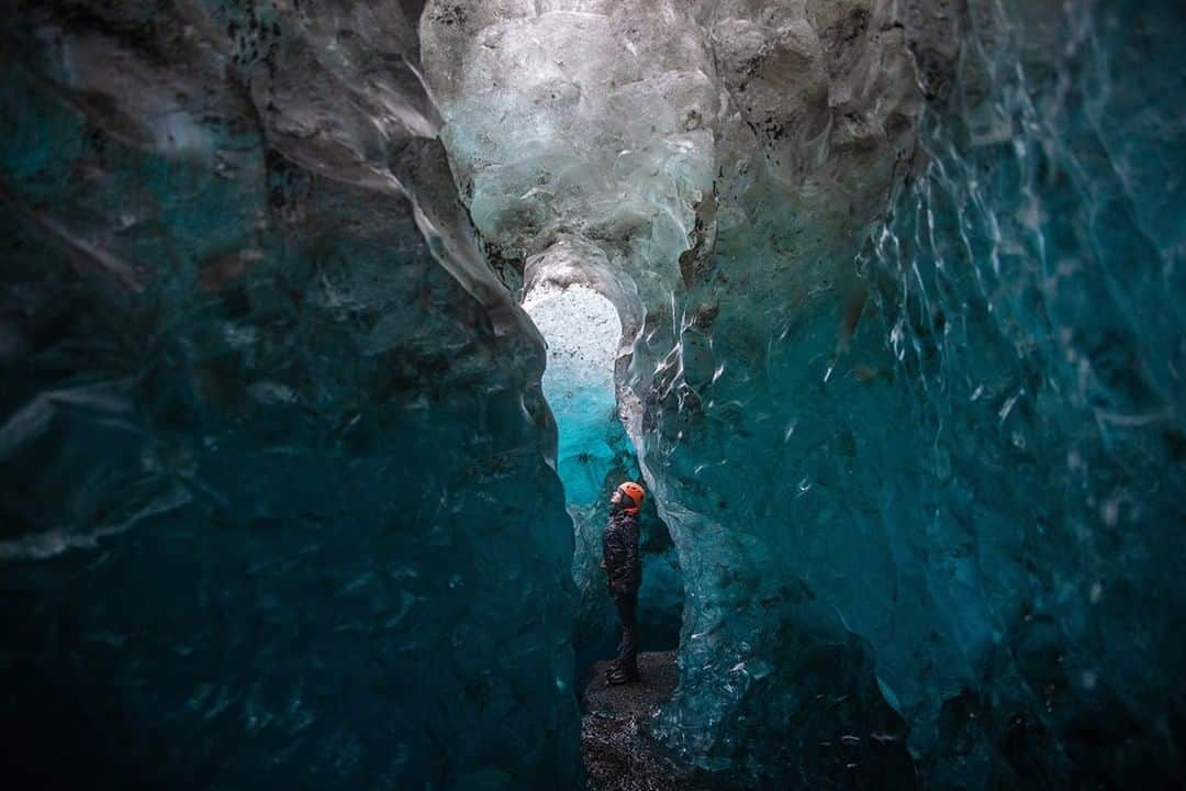 National Geographic Travelさんのインスタグラム写真 - (National Geographic TravelInstagram)「Photo by @mborowick | Winter is one of the best times to go ice cave exploring in Iceland. The season is rather short, though— they're only open for those few months before they become too dangerous during the spring and summer seasons. Caves like this one are formed when meltwater flows down a glacier, carving out a network of tunnels in the freeze. The chance to hike one these incredible places can be a once in a lifetime adventure. #icecave #iceland #nature #nordic #explore」7月3日 19時00分 - natgeotravel