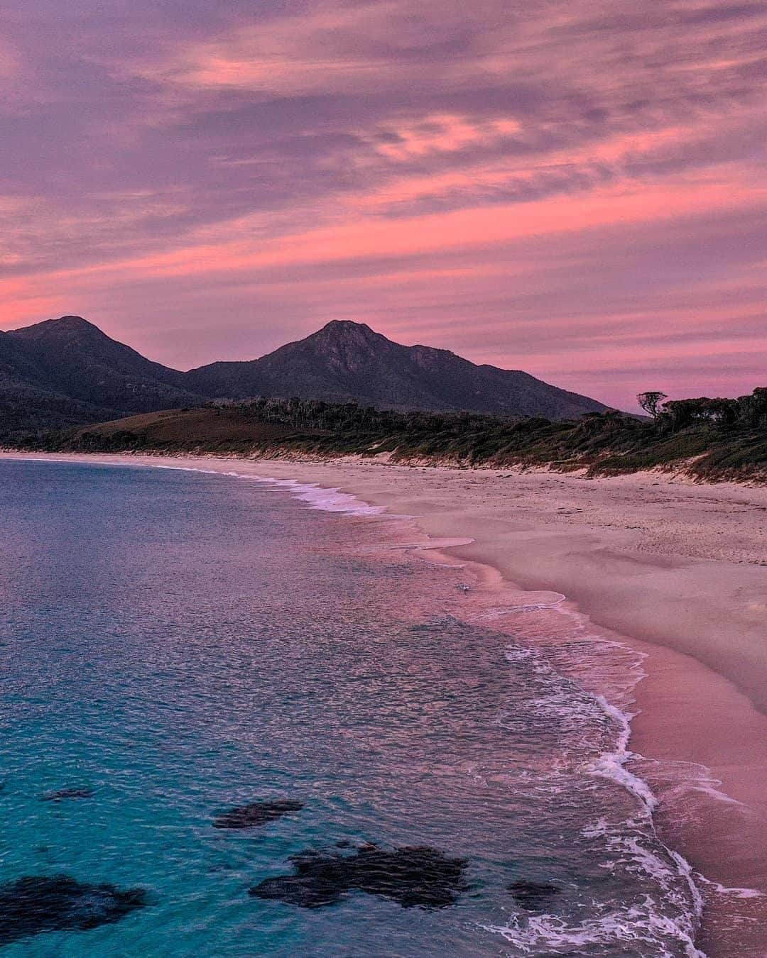 Australiaさんのインスタグラム写真 - (AustraliaInstagram)「A perfect pop of purple to start the day in #FreycinetNationalPark. 💜 According to @envy_digital, he got up at 5am and hiked in the dark in order to get to this serene spot on #WineglassBay by #sunrise, and we think it’s totally worth it! Situated on @tasmania’s beautiful @eastcoasttasmania, you can spend days discovering secluded bays, white sandy beaches and wildlife in this national park. Our tip: Treat yourself to an indulgent dinner at @saffirefreycinet and fresh oysters at @melshell_oysters.After all the walking, they’ll taste extra delicious. 😉  #seeaustralia #discovertasmania #eastcoasttasmania #thegreatoutdoors #travel」7月4日 20時00分 - australia