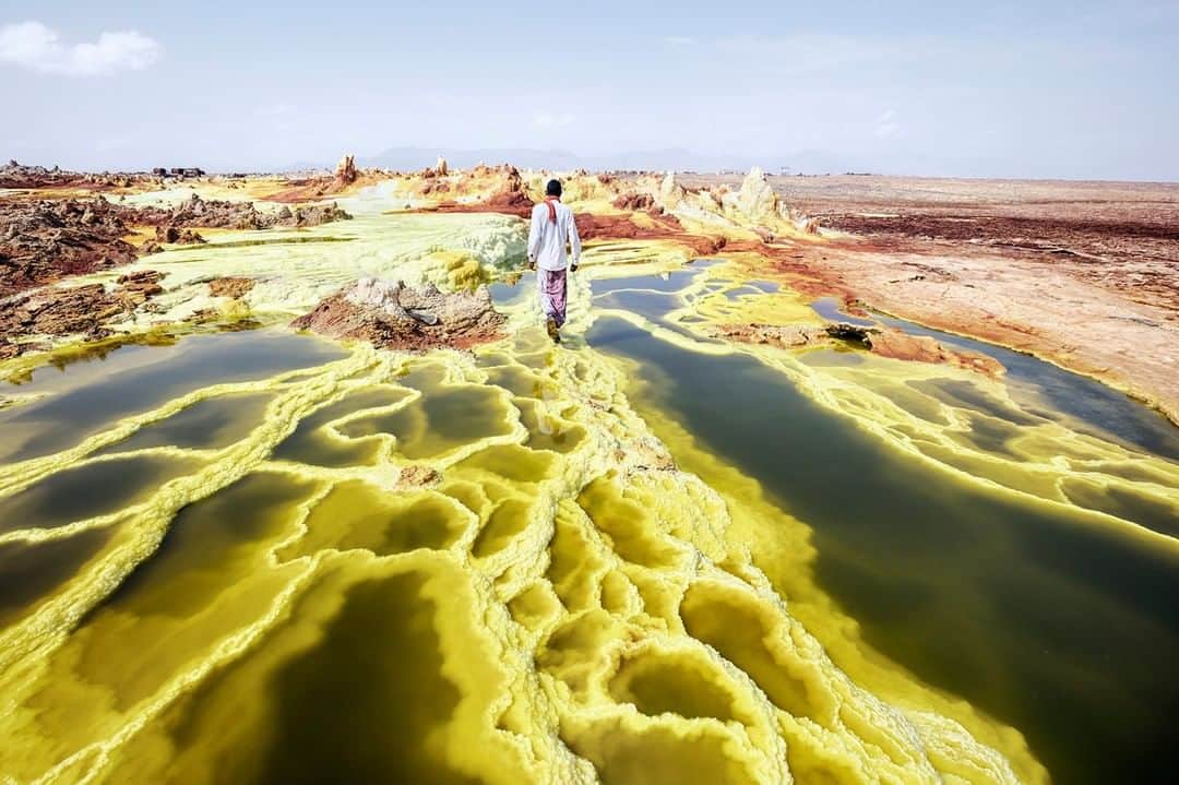 National Geographic Travelさんのインスタグラム写真 - (National Geographic TravelInstagram)「Photo by @andrea_frazzetta | Dallol is the "Hill of the Spirits" for the Afar Nomads. It's a land of geysers, crystal formations, and sulphurous springs. Dallol is located in Ethiopia, in the Danakil Depression, a remote area subject to the highest average temperatures on the planet. The term Dallol was coined by the Afar people and means dissolution or disintegration, describing a landscape made up of acid ponds. To see more photos from my travels, follow me, @andrea_frazzetta #Danakil #Ethiopia #Africa #Dallol」7月5日 7時00分 - natgeotravel
