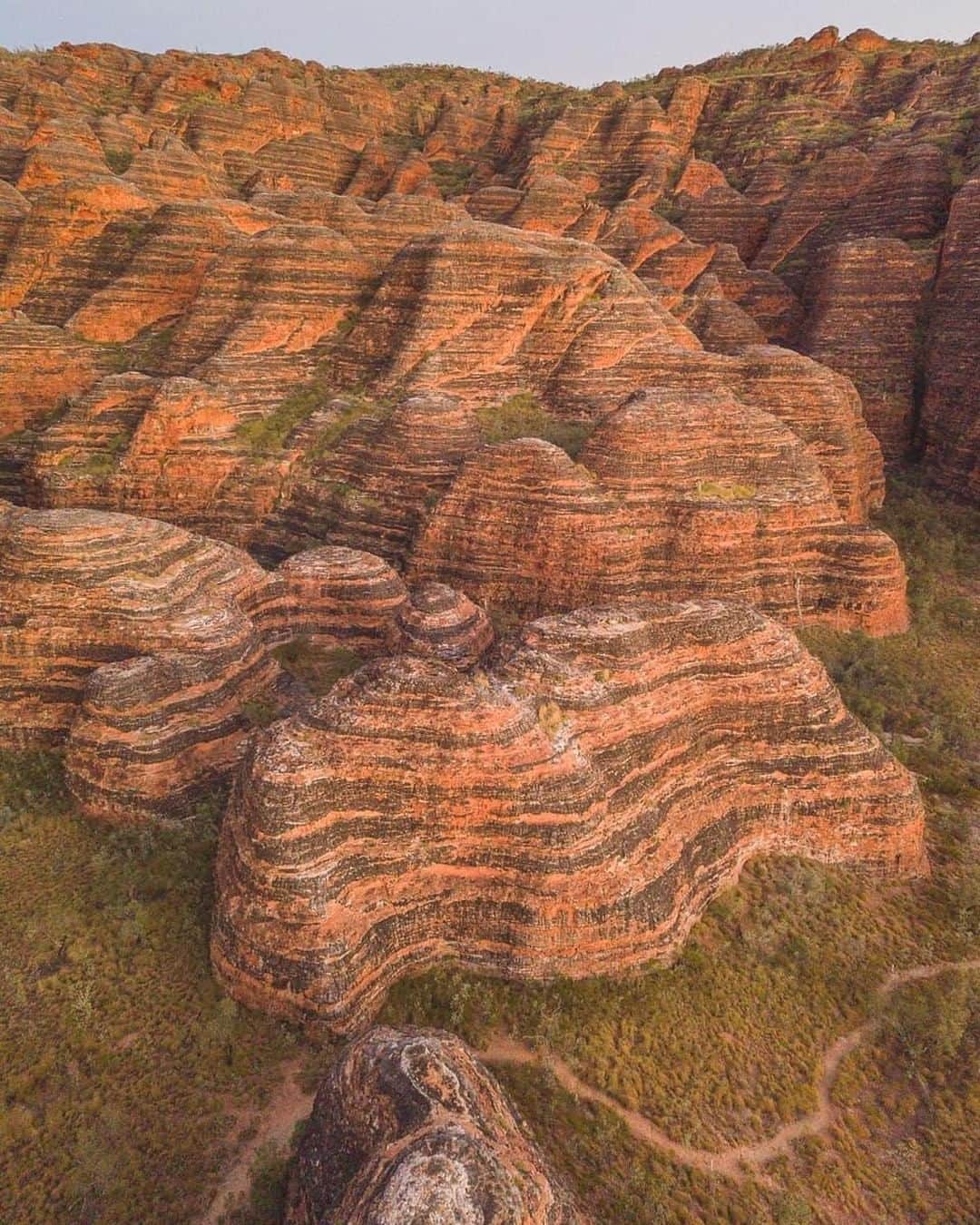 Australiaさんのインスタグラム写真 - (AustraliaInstagram)「The natural pattern of @westernaustralia’s #BungleBungles is truly un-bee-lievable. 🐝 @mitch.toft captured this incredible shot as “these beehive-like rocks put on quite the show as the first rays of light hit them in the early morning.” Located in @thekimberleyaustralia’s #PurnululuNationalPark, this maze of black and orange striped sandstone domes have been around for more than 350 million years, and is now one of the most popular natural attractions in @australiasnorthwest. Get a sense of its scale on a scenic flight with @aviairwa, @helispirit or @kingfishertours, you’ll definitely be blown away.  #seeaustralia #justanotherdayinwa #australiasnorthwest #travel #thegreatoutdoors」7月5日 15時00分 - australia