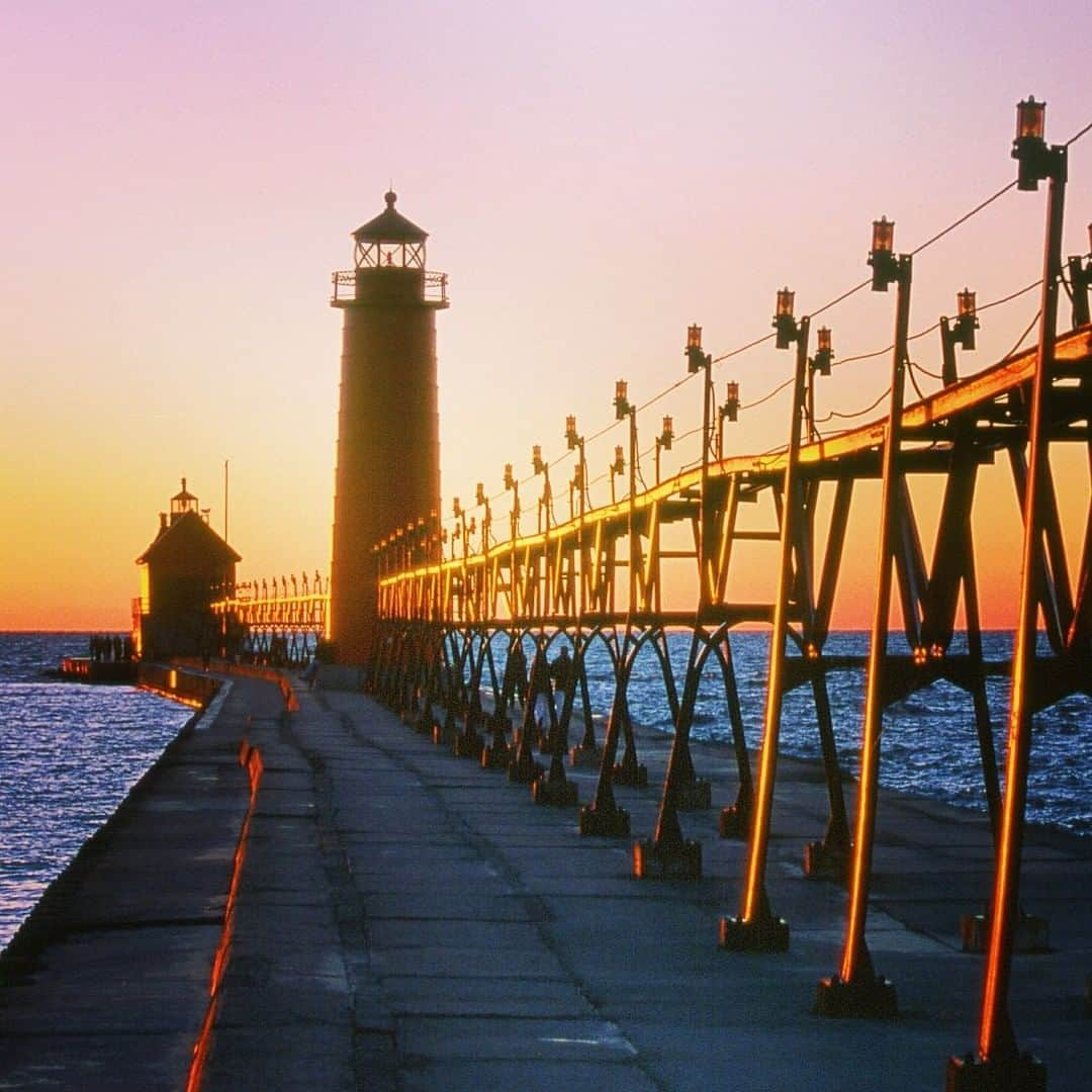 ナショナルジオグラフィックさんのインスタグラム写真 - (ナショナルジオグラフィックInstagram)「Photo by Ira Block @irablockphoto | Sun sets over Grand Haven Lighthouse on Lake Michigan. The lighthouse was completed in 1839 and rebuilt in 1905, with the pier extended and the fog-signal building moved to the end of the pier. This active, automated lighthouse is owned by the the city and maintained by the Army Corps of Engineers. Michigan has the most lighthouses of any state in the country, recorded to be around 130. #followme @irablockphoto for more travel stories.  #lighthouses #lakemichigan #grandhavenlighthouse #irablock」7月6日 6時35分 - natgeo