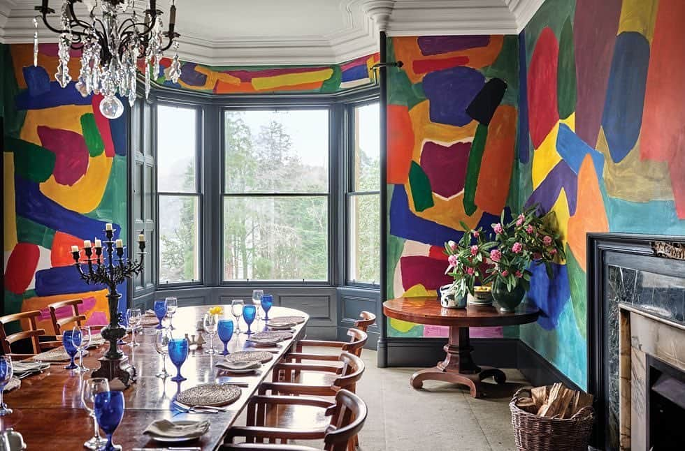 ELLE DECORさんのインスタグラム写真 - (ELLE DECORInstagram)「Entrepreneur @vanessagbranson is known for transforming vacation houses into inviting hotels, and her @eileanshona property in Scotland is the perfect example. The dining room features a 1920s English conference table and 1930 dining chairs from Overstrand Hall. The chandelier is original and the mural is by Fred Pollock. Click the link in bio for the full tour, as seen in our July/August 2019 issue. Photography by James Merrell.」7月7日 7時46分 - elledecor