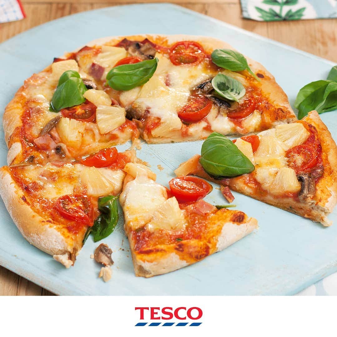 Tesco Food Officialさんのインスタグラム写真 - (Tesco Food OfficialInstagram)「Pizza party at your place! Don’t worry, this classic pizza recipe makes it easy - from the fresh base to cheesy toppings it’s a quick, healthier and kid-friendly alternative to a take away. Time to come up with some brave new combinations…  Ingredients For the base 300g (10oz) strong white flour 1/2 teaspoon salt 7g (1/4 oz) sachet fast action yeast 200ml (1/3 pint) warm water 15ml (1 tbsp) olive oil For the topping 1 garlic clove, crushed 150ml (5fl oz) passata handful basil leaves 125g (4oz) ball mozzarella cheese  Method 1. Preheat the oven to Gas Mark 9, 240°C, fan 220°C. Tip the flour, salt and yeast into a large mixing bowl. Pour over the water and oil and, using a metal spoon, mix together until you have a sticky dough. 2. Dust the work surface with more flour, then tip out the dough. Knead until the dough starts to feel elastic and smooth, about 10 minutes. 3. Clean and lightly oil the mixing bowl, and then return the dough to it. Cover the bowl with a sheet of clingfilm coated in a little oil to stop the dough from sticking. Leave in a warm place until the dough has doubled in size, about 1 hour. 4. Make a tomato sauce by stirring together the garlic and passata. Snip or finely chop a couple of basil leaves, add to the sauce and season. 5. Lightly flour 2 baking sheets and the work surface. Knock the air out of the dough by punching it down, and then divide it into 2 pieces. Use a lightly floured rolling pin or your fingers, to press out the dough into two thin circles. If you're pressing out the dough, start with a ball of dough and flatten it using your palms, then press the edges away with your fingers, turning the dough round as you go. Eventually you'll end up with a nice round circle. Carefully lift the circle onto a baking sheet, and spread out with your fingers until about 30cm (12in) wide. Repeat. 6. Spoon over the sauce, leaving a border of about 1cm (1⁄2in). Tear the mozzarella into pieces and scatter over the pizza, along with any toppings. Drizzle over a little oil, and bake for 12-15 minutes, or until the base is crisp. Scatter over some remaining basil leaves to serve, if you like.」7月7日 1時06分 - tescofood