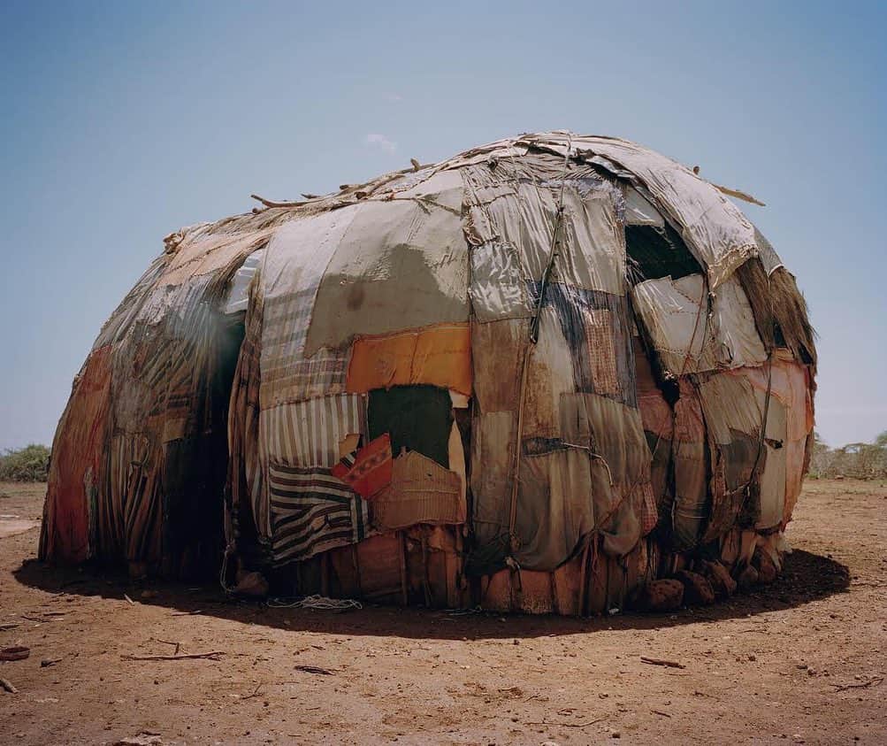 thephotosocietyさんのインスタグラム写真 - (thephotosocietyInstagram)「Photograph by David Chancellor @chancellordavid | Gabra house, northern Kenya. The Gabra, a nomadic tribe of 31,000 people, occupy territory east of Lake Turkana in Kenya, along the edge of the Chalbi Desert, extending to Ethiopia. For the Gabra, to live in balance with a trying environment they protect land, animal, and fellow Gabra. Thus, they practice certain food and plant taboos, preserve full-grown trees called "korma" (bulls), and revere pregnant women and pregnant animals. As resource managers, they migrate to the highlands during the rainy season to allow the dry season pasture to replenish its water resources, taking homes, livestock, and all possessions with them. Perhaps most symbolic of the Gabra's identity is the proverb: "a poor man shames us all." Since mutual support is imperative for their survival as nomads, no Gabra may be allowed to go hungry, go without animals, or be refused hospitality or assistance. A person who refuses to help others is labeled "al baku," a stigma that stays affixed to the family for generations. #withbutterfliesandwarriors #northernkenya #kenya #conservation #conserving #fightingextinction @everydayextinction」7月7日 11時15分 - thephotosociety