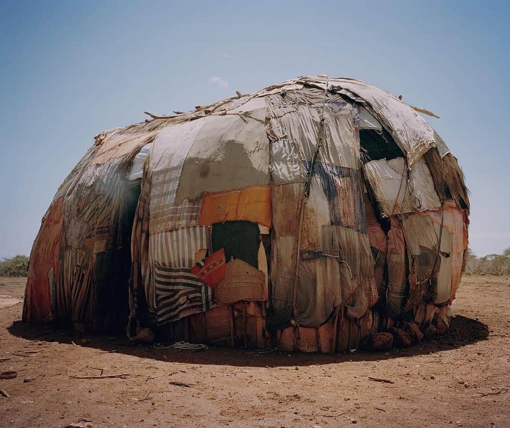 thephotosocietyさんのインスタグラム写真 - (thephotosocietyInstagram)「Photograph by David Chancellor @chancellordavid | Gabra house, northern Kenya. The Gabra, a nomadic tribe of 31,000 people, occupy territory east of Lake Turkana in Kenya, along the edge of the Chalbi Desert, extending to Ethiopia. For the Gabra, to live in balance with a trying environment they protect land, animal, and fellow Gabra. Thus, they practice certain food and plant taboos, preserve full-grown trees called "korma" (bulls), and revere pregnant women and pregnant animals. As resource managers, they migrate to the highlands during the rainy season to allow the dry season pasture to replenish its water resources, taking homes, livestock, and all possessions with them. Perhaps most symbolic of the Gabra's identity is the proverb: "a poor man shames us all." Since mutual support is imperative for their survival as nomads, no Gabra may be allowed to go hungry, go without animals, or be refused hospitality or assistance. A person who refuses to help others is labeled "al baku," a stigma that stays affixed to the family for generations. #withbutterfliesandwarriors #northernkenya #kenya #conservation #conserving #fightingextinction @everydayextinction」7月7日 11時15分 - thephotosociety