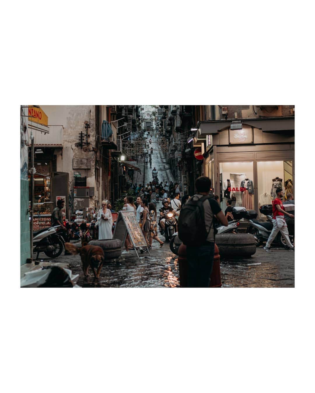 Putri Anindyaさんのインスタグラム写真 - (Putri AnindyaInstagram)「Half day in Napoli // I stayed in Pompeii for two nights and decided to visit Naples for the sake of my fav pizza, Neapolitan. Because @capra311 knew how small and chaotic the streets in Naples, he decided to park the car and bought the metro ticket to shoot around. The problem was, the metro line 1 is not working that day. So we took the other line and Voila, we arrived to this market with chaos everywhere. . .  A very surprising welcome for me and felt a little bizzare cause somehow it looked a little like Bekasi or Jakarta market area. The smell of the trash, fish, motorcycle pollution, food, like mixed into one. Everywhere you look there will be motorcycle. It feels like home a little until someone looked at me and called me "turismo" when i took pict of Maradona grafitti. I almost answered to him, "no shit i am" but i don't want to make a trouble in this city lol. Anyway i loved the picts that i took here so i will share more of Napoli picts soon!」7月7日 21時35分 - puanindya