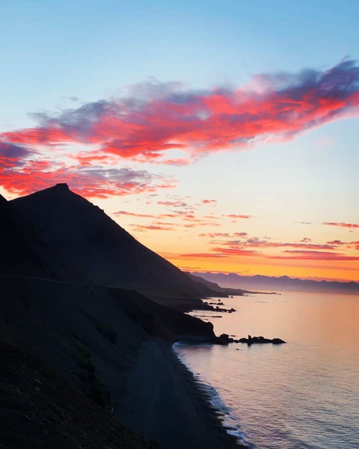 クリス・バーカードのインスタグラム：「The only moment I stepped off my bike in 52 hours was for this sunrise in the Eastfjords of Iceland. It was the calmest moment of the whole trip... right before the windiest. I took a moment to appreciate it. . Shot on iPhone with wide angle @olloclip」