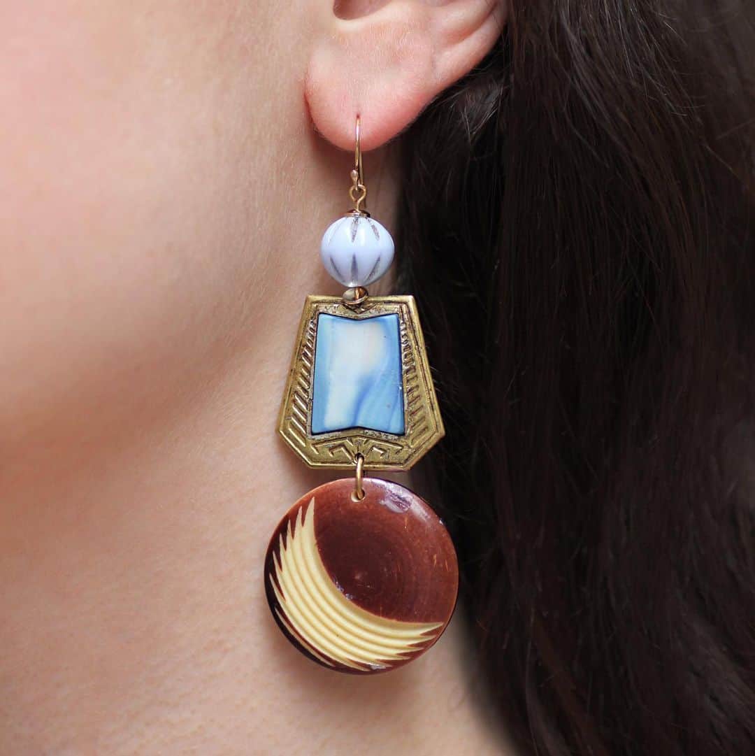 のインスタグラム：「These one-of-a-kind beauties pair Art Deco celluloid discs c1930s with a modern incised crescent moon motif,  unique brass and dyed mother of pearl elements c1910s and periwinkle blue milk glass beads c1910s. Shop all of our vintage earrings via link in bio. #lulufrost」