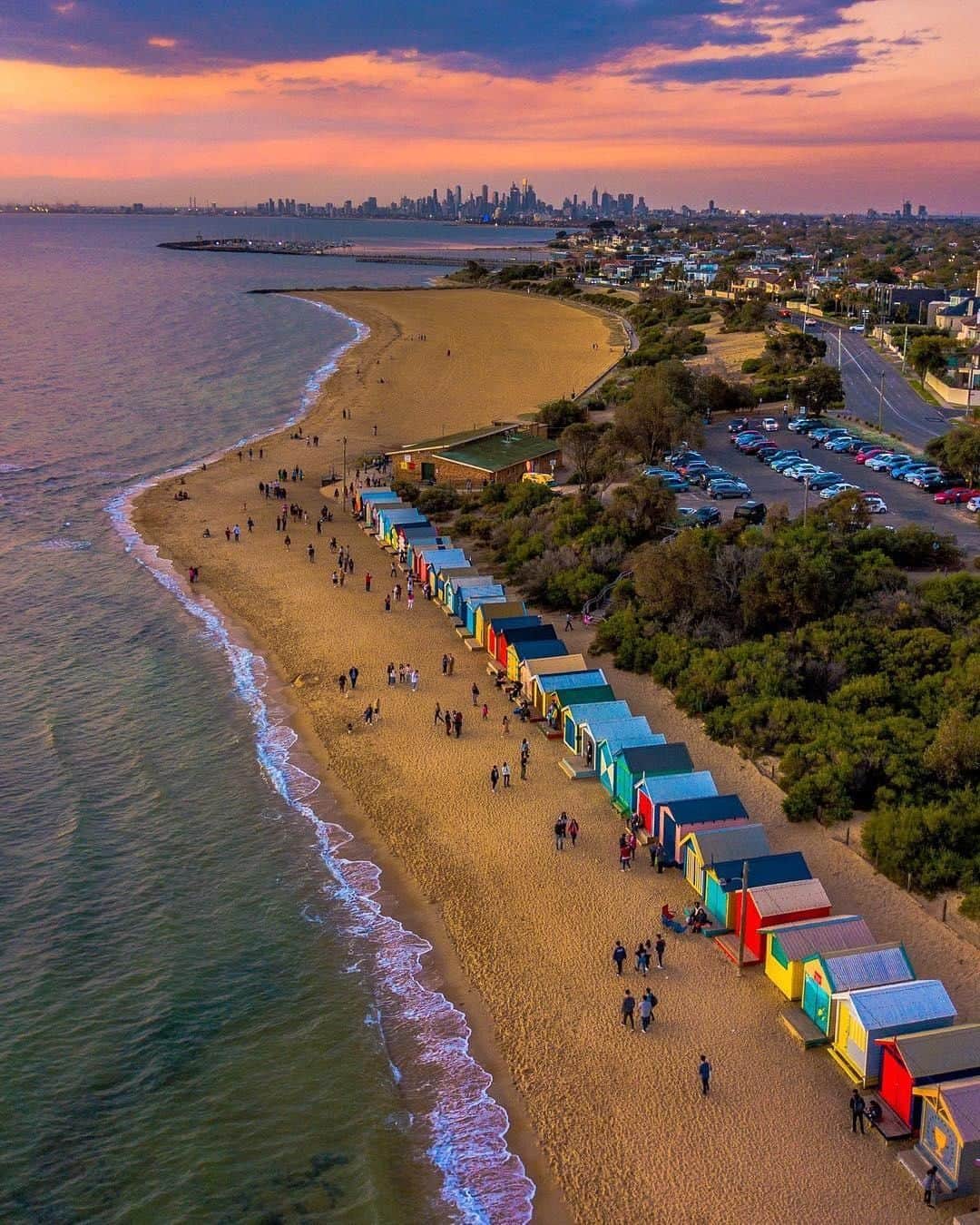 Australiaさんのインスタグラム写真 - (AustraliaInstagram)「Looks like @visitmelbourne’s colourful sunsets have finally met their match.🏠 @rayofmelbourne captured the brightly coloured #BrightonBathingBoxes on #BrightonBeach just 30 minutes out of the city, where you can see the #skyline in the background. These wooden boxes were built over a century ago for seaside bathing, but are now mainly used for storage and acting as the perfect backdrop for your profile pictures. 😉 Grab a coffee from the nearby @mylk.cafe.brighton or @holygroundsbrighton to take with you on the beach walk; it’ll take you a while to see all 82 of them.  #seeaustralia #visitvictoria #visitmelbourne #landscapephotography #travel」7月8日 20時00分 - australia