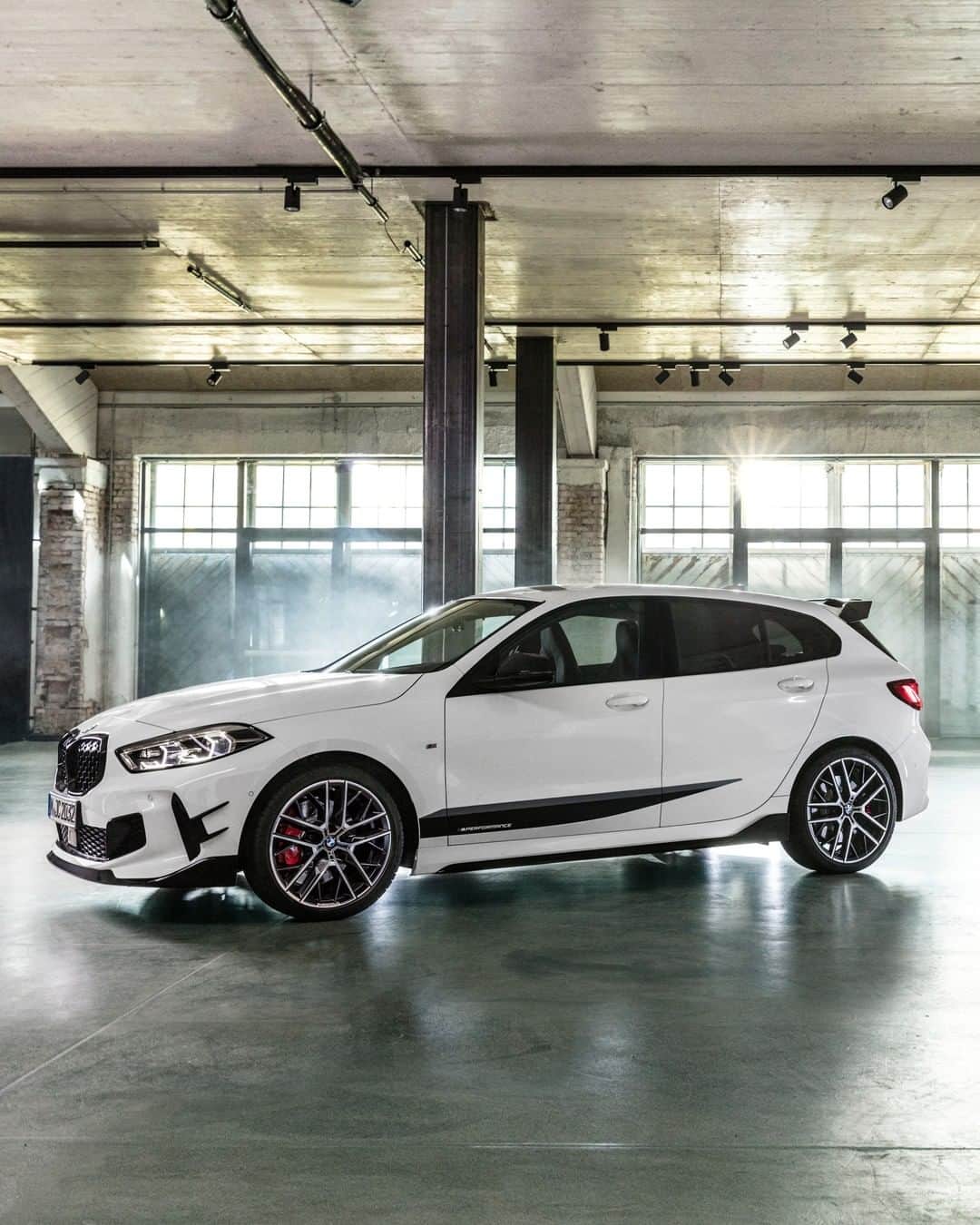 BMWのインスタグラム：「An unmistakable sporty driving experience. The M Performance Parts for the all-new BMW 1 Series. #THE1 #BMW #1series __ BMW M135i xDrive 5-door: Fuel consumption in l/100 km (combined): 7.1 - 6.8. CO2 emissions in g/km (combined): 162 - 155. The values of fuel consumptions, CO2 emissions and energy consumptions shown were determined according to the European Regulation (EC) 715/2007 in the version applicable at the time of type approval. The figures refer to a vehicle with basic configuration in Germany and the range shown considers optional equipment and the different size of wheels and tires available on the selected model. The values of the vehicles are already based on the new WLTP regulation and are translated back into NEDC-equivalent values in order to ensure the comparison between the vehicles. [With respect to these vehicles, for vehicle related taxes or other duties based (at least inter alia) on CO2-emissions the CO2 values may differ to the values stated here.] The CO2 efficiency specifications are determined according to Directive 1999/94/EC and the European Regulation in its current version applicable. The values shown are based on the fuel consumption, CO2 values and energy consumptions according to the NEDC cycle for the classification. For further information about the official fuel consumption and the specific CO2 emission of new passenger cars can be taken out of the „handbook of fuel consumption, the CO2 emission and power consumption of new passenger cars“, which is available at all selling points and at https://www.dat.de/angebote/verlagsprodukte/leitfaden-kraftstoffverbrauch.html.」