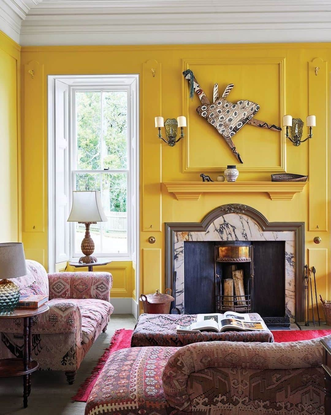 ELLE DECORさんのインスタグラム写真 - (ELLE DECORInstagram)「Mellow yellow. 💛 For the sitting room in her romantic @eileanshona hotel off the coast of Scotland, entrepreneur @vanessagbranson chose Art Deco sconces and an artwork by Beezy Bailey over the original mantel. The pineapple lamp is from Marrakech, the walls are in Farrow & Ball’s Yellow Ground, and the trim is in Pointing. Click the link in bio for the full tour, as seen in our July/August 2019 issue. Photography by James Merrell.」7月9日 2時38分 - elledecor