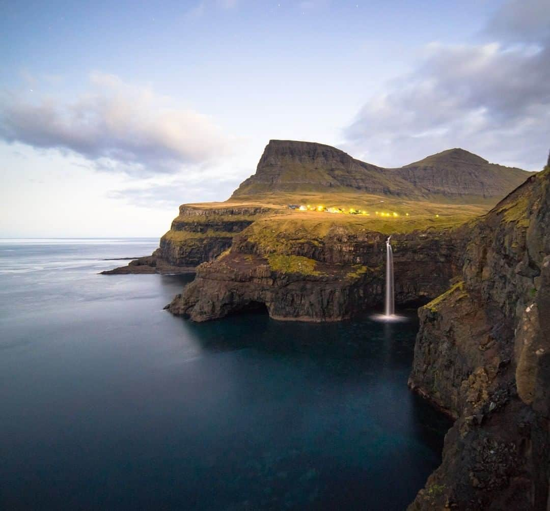 National Geographic Travelさんのインスタグラム写真 - (National Geographic TravelInstagram)「Photo by @Chrisburkard | In between Iceland and Norway lies a chain of 18 volcanic islands that make up the self-governing archipelago of the Faroe Islands. Here, sweeping green valleys meet dramatic, steep cliffs. They’re remote and untouched to a degree that’s hard to explain without experiencing them for yourself. In 2007, National Geographic declared them “the most unspoiled islands in the world.” We came in search of waves and were blown away by how true to its roots the area was. Encountering other people was rare.」7月10日 4時01分 - natgeotravel