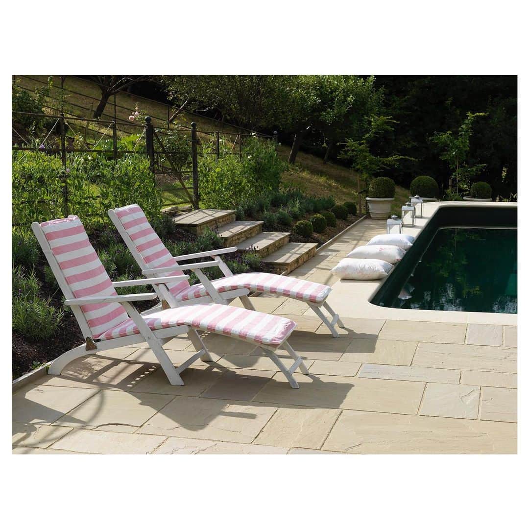 キャベジズ&ローゼズのインスタグラム：「Moment in the Sun ☀️ Printed on a pure white linen base cloth, C&R’s Three Inch Stripe White Rose Fabric is just at home outside as it is inside. Perfect for all your interiors and exterior needs, this delicious stripe-y fabric is made to order in England #interiordecor #britishmade #printedtextiles #printedtoorder #interiordecorating #pinkfabric #sustainableliving #linenfabric #cabbagesandroses #cabbagesandrosesfabric @christina_strutt @cabbagesandroses_shop 👆Link In Bio👆」