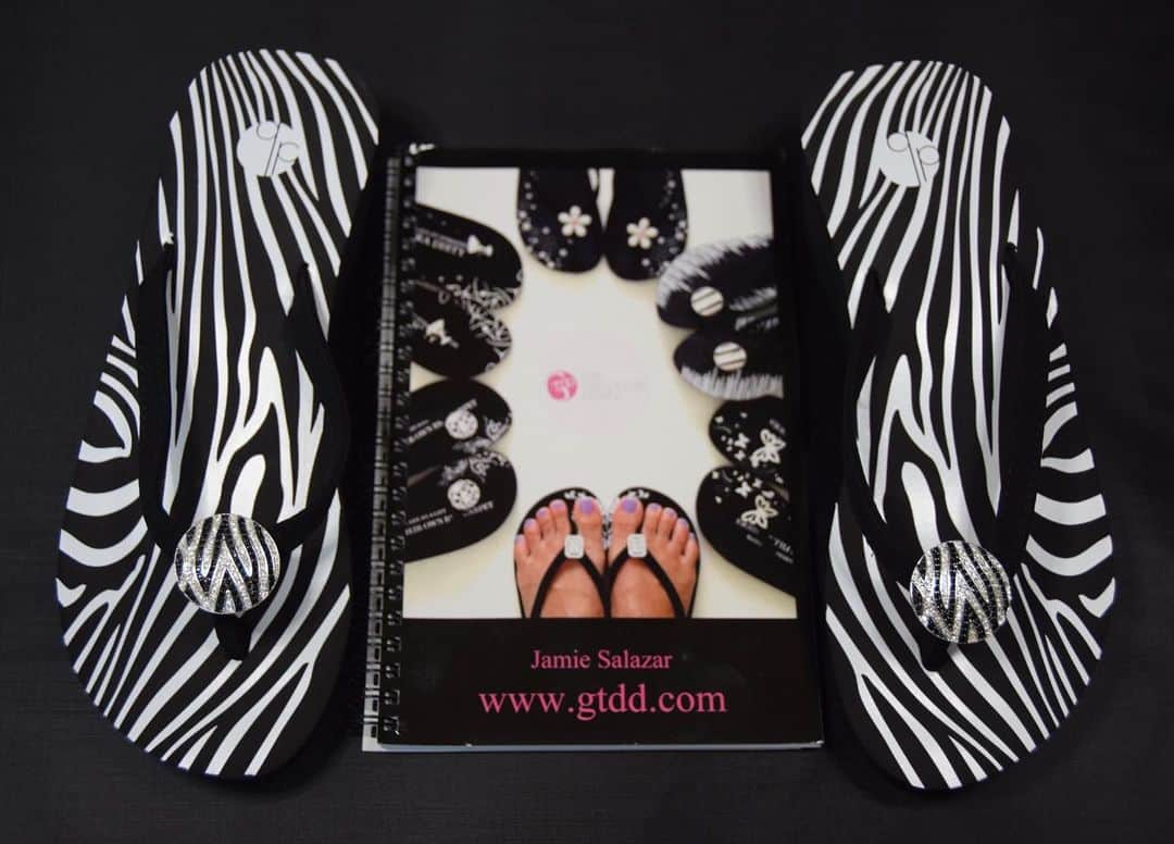 ガールトゥードアーズダウンのインスタグラム：「Are you feeling wild today  Buy a pair of our Zebra Print Flip Flops  Shop now www.gtdd.com #gtdd #flipflops #zebraprint #zebra #blackflipflops #shopnow #sale #bling #blingbling #style #trinidadcolorado #celebrityworn #celebrity」