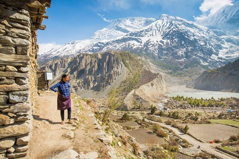 National Geographic Travelさんのインスタグラム写真 - (National Geographic TravelInstagram)「Photo by @emilypolar | A woman stands outside of her traditional, flat top brick home in the village of Manang, Nepal. The eastern side of the Annapurna mountain range rises in the background with Gangapurna Lake and its glacier visible in the next photo. To see more of Nepal and beyond, follow me @emilypolar. #Nepal #Himalaya #Manang」7月10日 22時26分 - natgeotravel