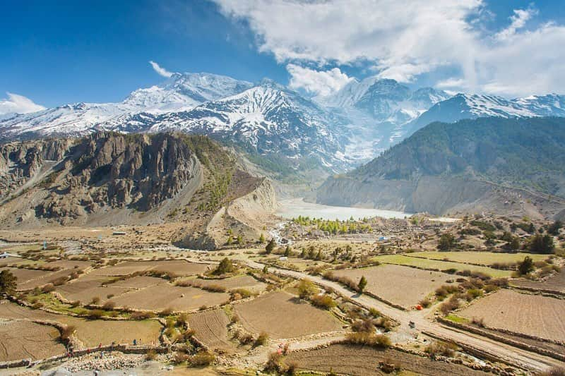 National Geographic Travelさんのインスタグラム写真 - (National Geographic TravelInstagram)「Photo by @emilypolar | A woman stands outside of her traditional, flat top brick home in the village of Manang, Nepal. The eastern side of the Annapurna mountain range rises in the background with Gangapurna Lake and its glacier visible in the next photo. To see more of Nepal and beyond, follow me @emilypolar. #Nepal #Himalaya #Manang」7月10日 22時26分 - natgeotravel