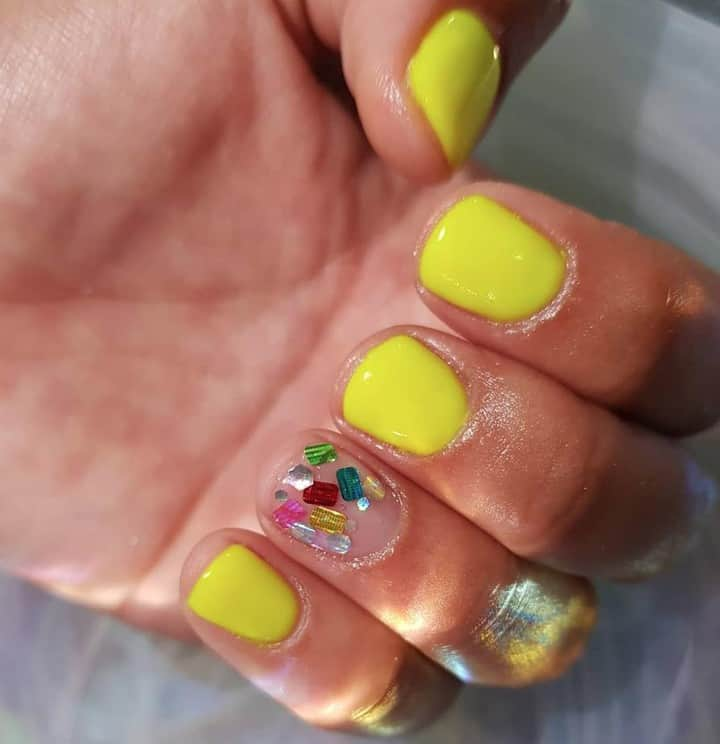 OPIさんのインスタグラム写真 - (OPIInstagram)「We're #OPIObsessed with this dazzling #OPINeons manicure using #PumpUpTheVolume by @thenailsuitepr ✨💅 #ColorIsTheAnswer⁠ ⁠ #NeonNails #NailBling ##rhinestonenails #yellownails #notd  #bling #brightnails」7月12日 1時01分 - opi