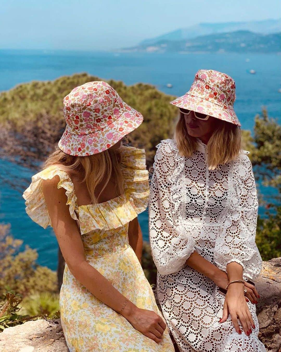 ジマーマンさんのインスタグラム写真 - (ジマーマンInstagram)「Goldie Girls: @marthaward wears our Goldie Ruffle Neck Long Dress and @candela_________ wears our Goldie Scallop Lace Long Dress with our bucket hats from Summer Swim 19 while out and about in Capri. #summerswim19 #zimxcapri #zimmermann」7月12日 16時03分 - zimmermann