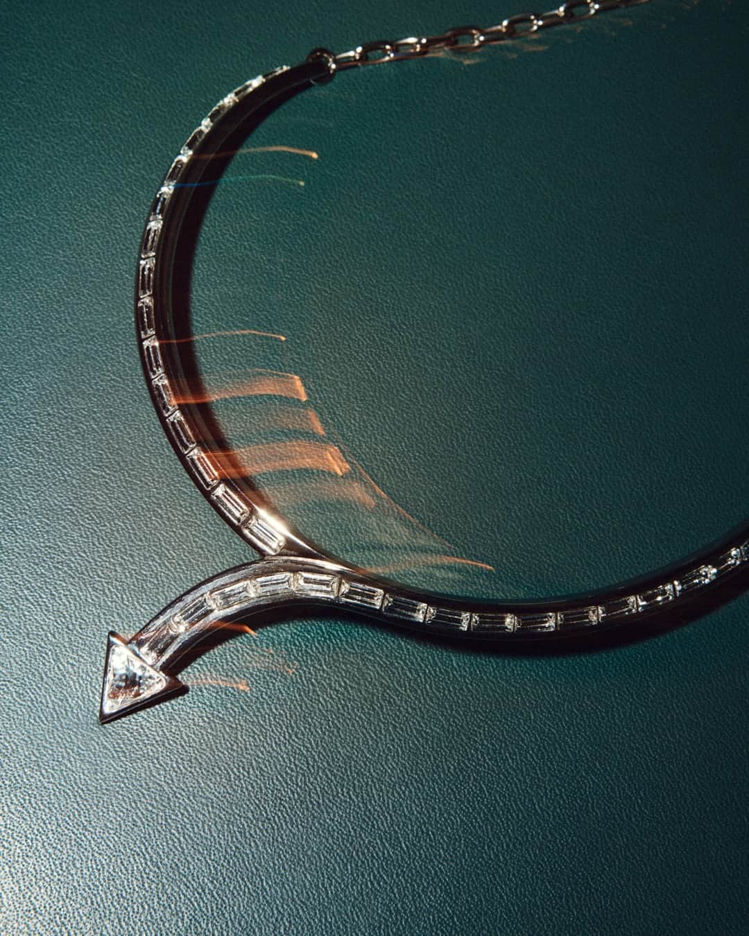 Chloéのインスタグラム：「The Thelma necklace is a Karl Lagerfeld-inspired finishing touch to party season outfits – its arrow motif traced in baguette crystals references the creative visionary's designs for the Maison in the 1980s.」