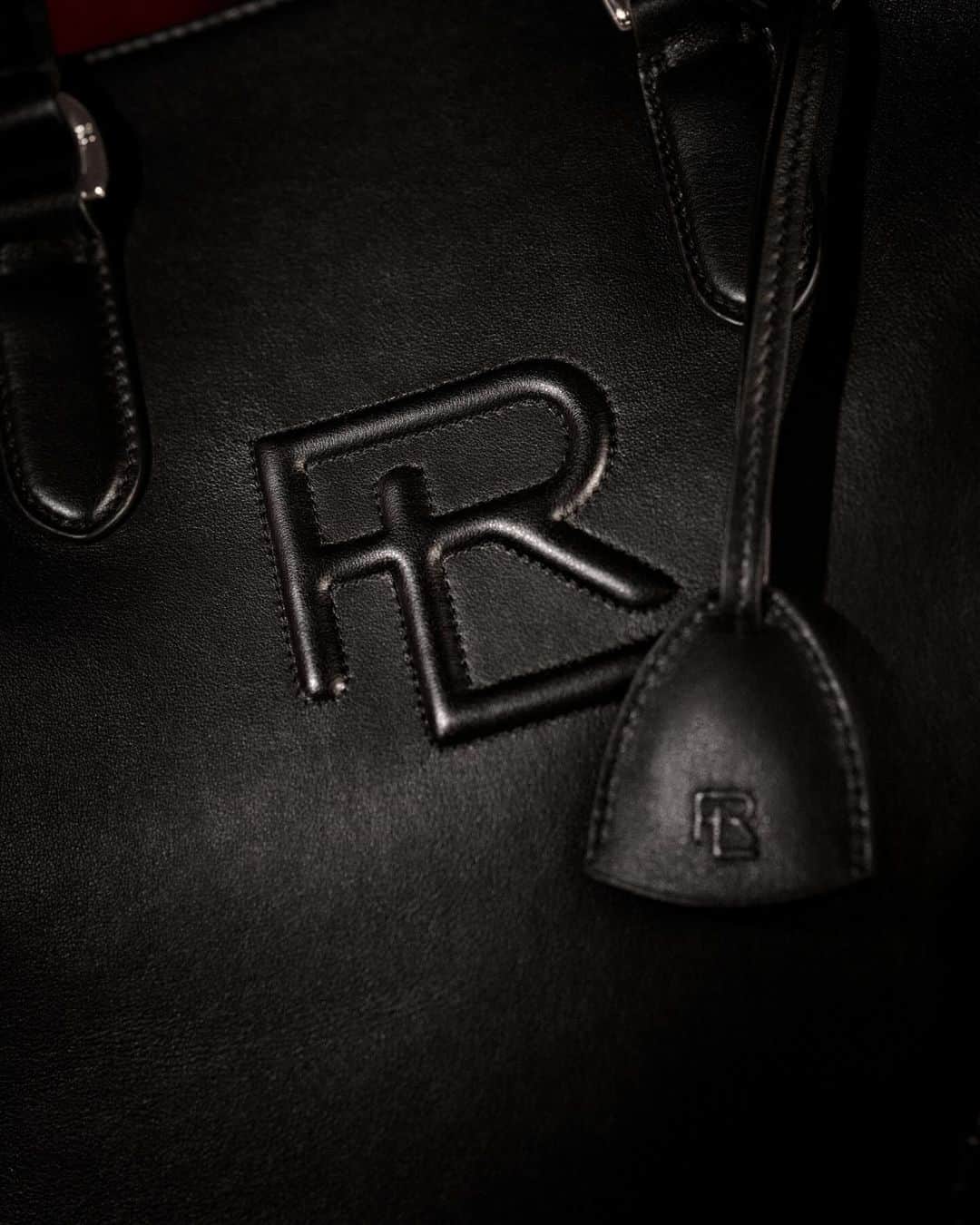 Ralph Laurenのインスタグラム：「Signatures made new.  #RalphLauren’s monogram is presented in embossed black leather and gold-tone metal across this season’s #RLGifts, including the Monogram Quilted Leather Tote and cashmere-lined gloves from #RLCollection.  Discover more from #RLHoliday via the link in bio.  #RLPurpleLabel」