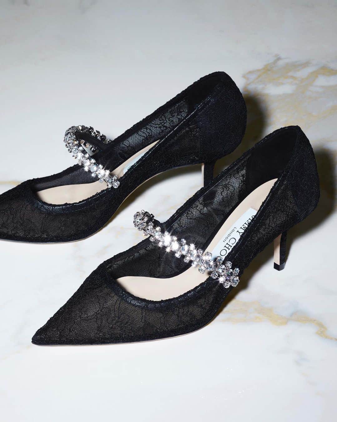 Jimmy Chooのインスタグラム：「Capture the splendour of the festive season with glamorous gifts from our collection of Icons; the new Bing Pumps are a future classic  #JimmyChoo」