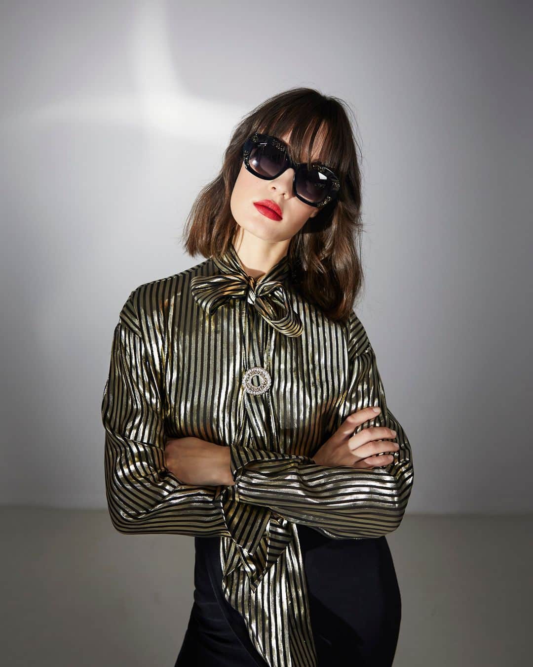 ジェニーのインスタグラム：「In the spotlight: metallic silver and black stripes dare to stand out, plunging in drama and unapologetic flair.  Discover Genny's signature style in boutiques and online on genny.com.  #Genny #MadeinItaly #FW2324」