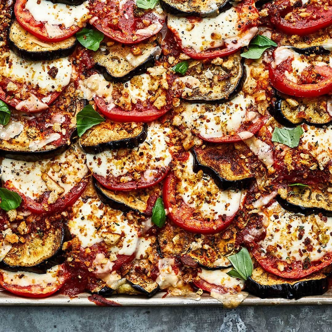 Food & Wineのインスタグラム：「Easy is the name of the game post turkey day, and it doesn’t get much easier than this Sheet Pan Eggplant Parmesan 🍆🍅🧀. Try it out at the link in bio. 📸: @protazio」