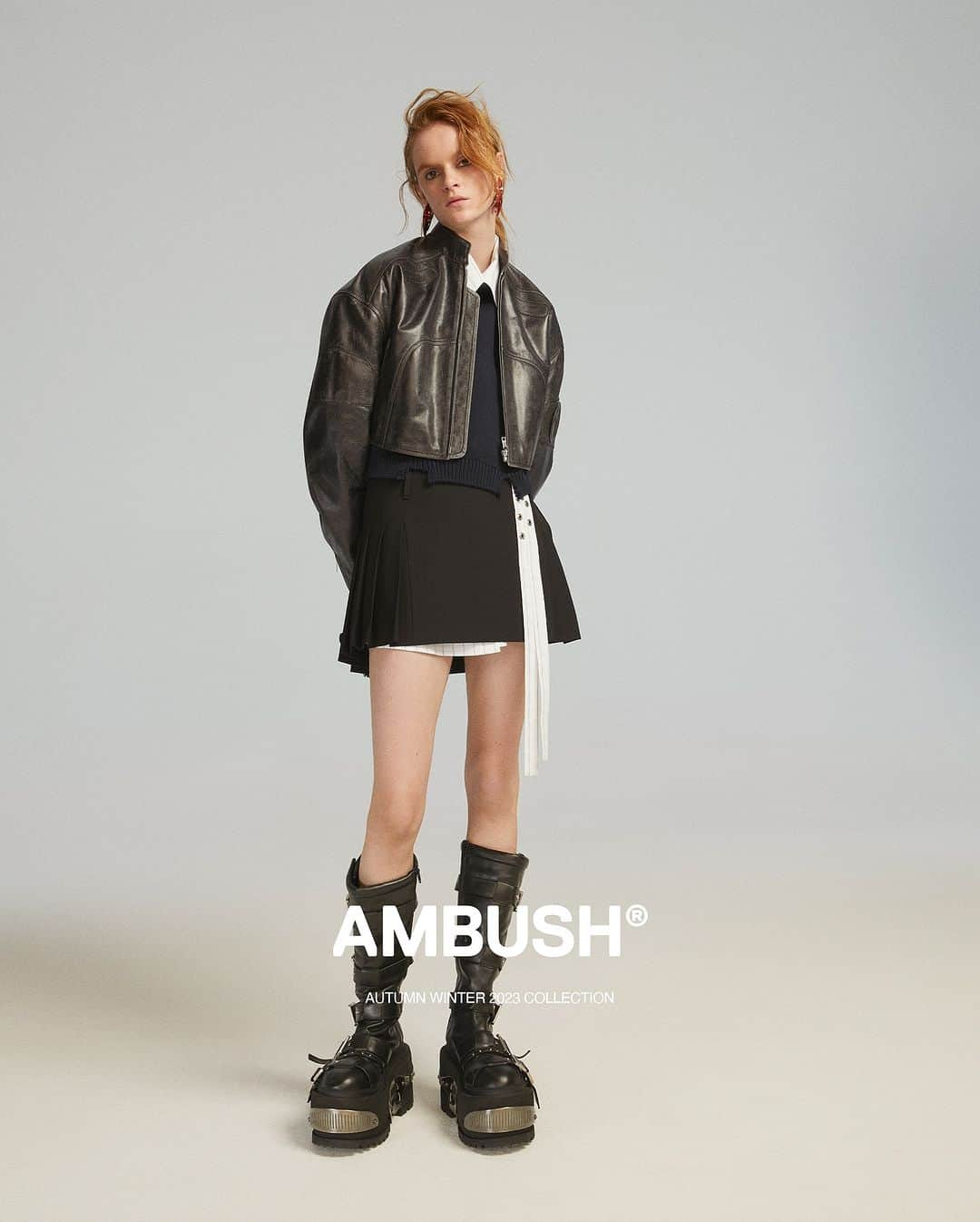 AMBUSHさんのインスタグラム写真 - (AMBUSHInstagram)「#AMBUSH AW23 COLLECTION LOOK 30  CROPPED LEATHER BIKER STRIPES CROSSED SHIRT DRESS FELTED KNIT CROPPED MOCKNECK PLEATED MINI SKIRT LARGE TRIBAL EARRINGS KNEE HI RAVE BOOT  Now available at our WEBSHOP and WORKSHOP」11月25日 17時52分 - ambush_official