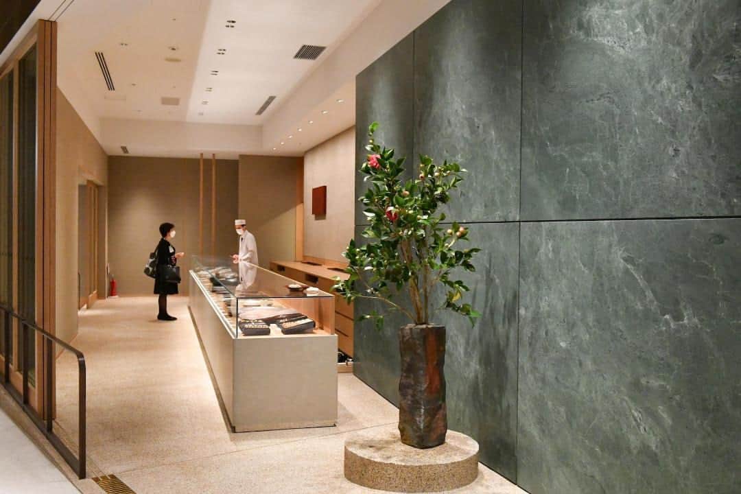 The Japan Timesさんのインスタグラム写真 - (The Japan TimesInstagram)「Mori Building’s new mixed-use complex in Tokyo, Azabudai Hills, is aiming to redefine city living by integrating extensive green spaces within a high-density urban area.  This reimagined “city within a city,” which opened in the capital's Minato Ward on Friday, will host approximately 20,000 office workers and 3,500 residents when fully occupied and is expected to welcome 30 million visitors per year.  Within this sprawling development is the main Mori JP Tower, which at 330 meters is now the tallest building in Japan and houses both residences and office spaces; the Keio University Center for Preventive Medicine; the primary school campus of the British School in Tokyo; the relocated teamLab Borderless Digital Museum; and two tall residence towers.  The project boasts about 24,000 sq. meters of green space, with the central area spanning approximately 6,000 sq. meters. The structures and landscape design, developed by U.K. firm Heatherwick Studio, showcase a range of plant species, with more than 320 different types planned for the area. Read more with the link in our bio.  📸: @louise.claire.wagner  #azabudaihills #tokyo #japan #moribuilding #architecture #design #HeatherwickStudio #teamlab #tokyoarchitecture #麻布台ヒルズ #東京 #建築 #森ビル #チームラボ #東京建築」11月26日 19時40分 - thejapantimes