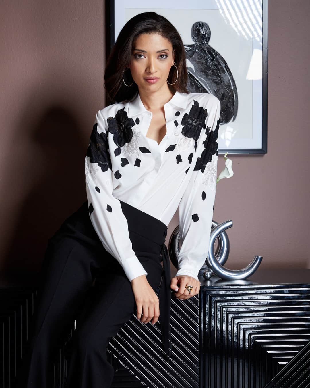 エリータハリのインスタグラム：「Discover the beauty of our Floral Applique Silk Shirt. Luxe Silk Georgette, hidden placket, and contrasting lace detailing redefine the classic button-down with feminine allure.   Available to shop at @saks, elietahari.com & Elie Tahari Collection Stores.」