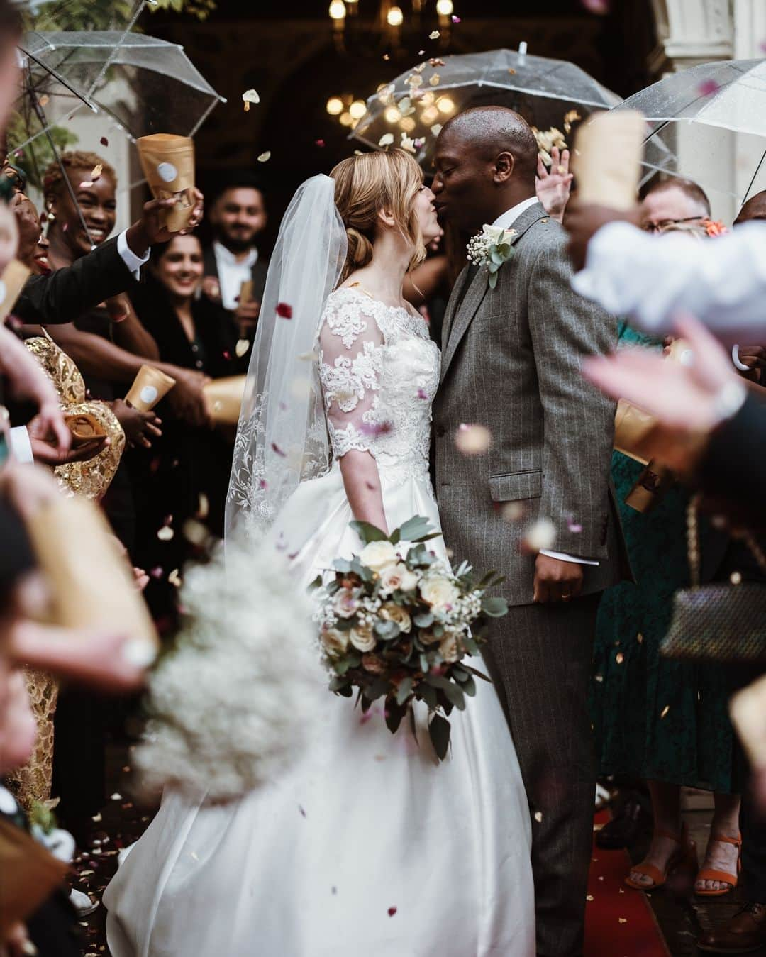 Fujifilm UKさんのインスタグラム写真 - (Fujifilm UKInstagram)「“This was taken at a wedding at Frimley Hall. It was still raining but the guests were happy to go out with umbrellas for the confetti shot. I really liked to include the umbrellas in the photo as rain featured heavily in the story on the day.  “I took this shot with a wide aperture to isolate the couple from the busyness in the scene. In order to do this effectively, I shot with manual focus to avoid miss-focusing on the confetti as it went in front of the lens.”  📸: @tomjeavons  #GFX100S GF80mmF1.7 R WR  f/1.7, ISO 160, 1/200 sec.」11月27日 21時04分 - fujifilmuk