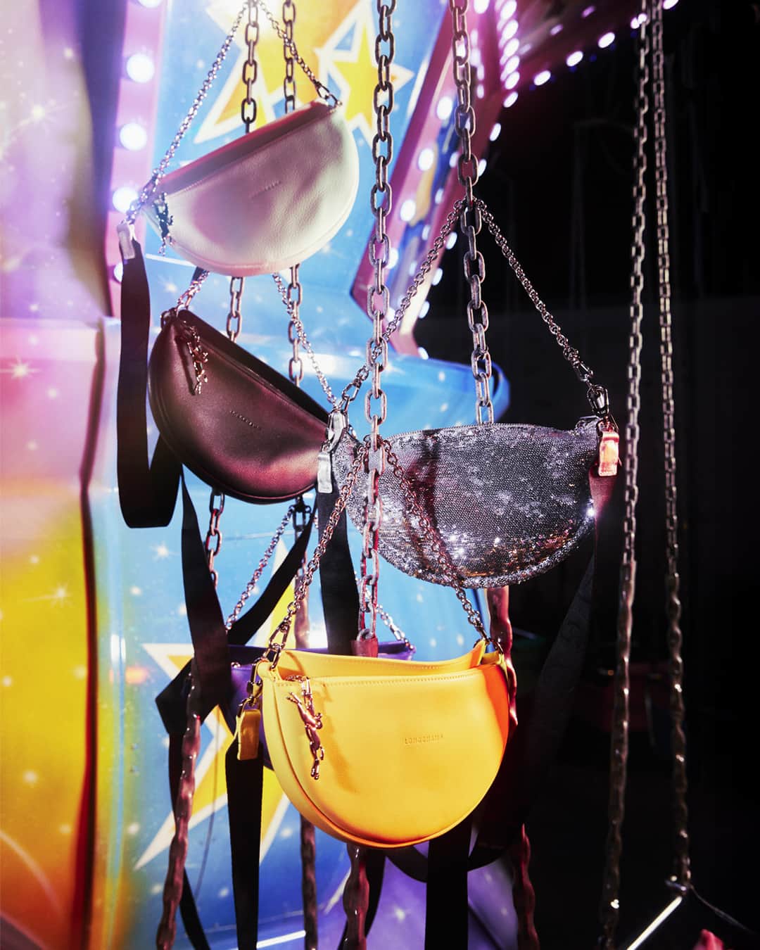 Longchampのインスタグラム：「Endless giggles.  Collection: #ParisIsAParty  Bag: #LongchampSmile Photographer: @guillaumesanner   #Longchamp #Parisisaparty #endoftheyear #newcollection #LongchampSS24 #christmas #christmasoutfit #newyear2024 #newyearoutfit #party #giftideas #colorfulbag #leatherbag #longchampbag #partyvibes #longchampsmile #shoulderbag」