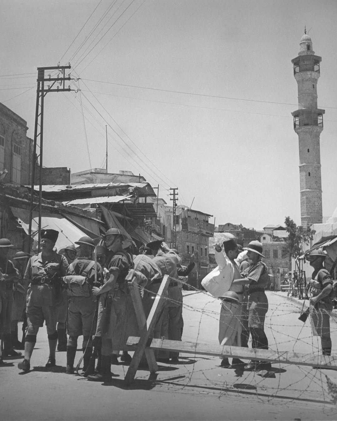 Magnum Photosのインスタグラム：「A selection of images from the Magnum archive relating to Israel, Palestine and the surrounding areas, dating back eighty years.  Magnum photographers have covered several key moments in the decades-long history of conflict and tension between Israel and Palestine, starting with @philippe_halsman_official’s photographs from 1936 showing tension building in Mandatory Palestine and continuing up until October 2023, with recently published work by @william.keo, @jeromesessini and @pvanagtmael from Israel and the West Bank.  🔗 View the full selection at the link in the @magnumphotos bio.  Magnum Photos stands for the freedom of the press and against the targeting or silencing of journalists in the field.  PHOTOS (left to right):  (1) The British Army and Palestine Police force searching passers-by in Jaffa during the Arab Revolt. Jaffa. 1936. © @philippe_halsman_official / Magnum Photos  (2) Two Palestinian girls reading in a refugee camp in the Jordan Valley. Jordan. 1952. © @georgerodgerphotos / Magnum Photos  (3) Israeli soldier in East Jerusalem knocks out the Arab sign naming the Wailing Wall as “Al-Buraq Wall.” 1967. © @michabaram.archive / Magnum Photos  (4) Woman with a rifle guards a flock of sheep on a Kibbutz. Golan Heights. 1973. © @thomashoepker / Magnum Photos  (5) Palestinians demonstrate for peace with olive branches next to Israeli Border Guards. West Bank. 1991. © @abbas.photos / Magnum Photos  (6) Young Palestinian man loading stone into a homemade catapult. West Bank. 2000 © Larry Towell / Magnum Photos  (7) Palestinian evicted from his home (left) by the Israelis because of its close vicinity to the ‘Security’ wall. Bethlehem, West Bank. 2005. © @marktpower / Magnum Photos  (8) Funeral of Avraham Walz, 29, killed in an attack earlier that day by a Palestinian in a stolen digger. Jerusalem. 2014. © Peter van Agtmael (@pvanagtmael) / Magnum Photos  (9) Clashes between Palestinian youth and Israeli forces following US president Donald Trump’s statement on Jerusalem status. Ramallah, West Bank. 2017. © @paolopellegrin / Magnum Photos  (10) Front door of a house is pierced by bullets. Kibbutz Kfar Aza, Israel. 2023. © @william.keo / Magnum Photos」