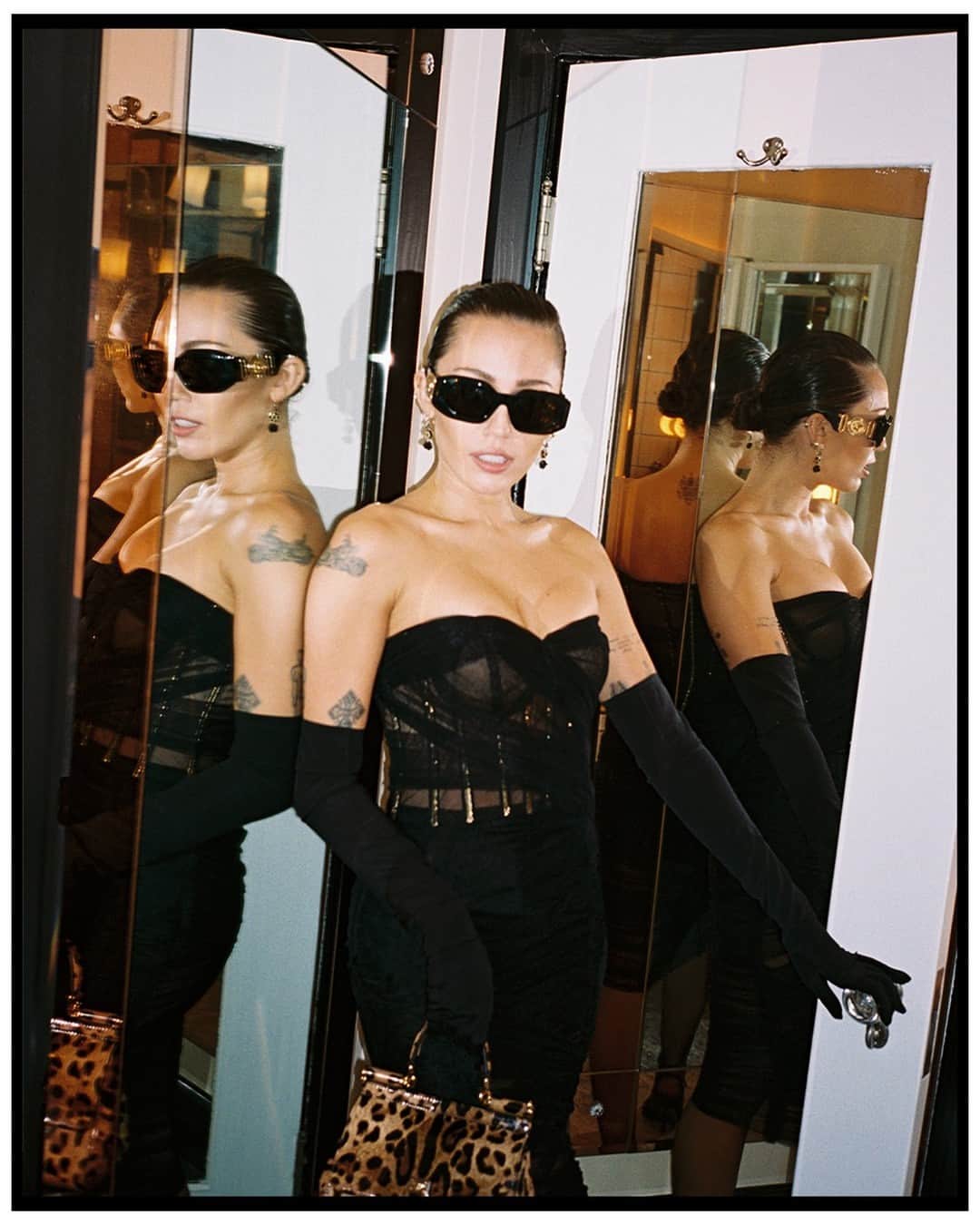 ドルチェ&ガッバーナのインスタグラム：「@mileycyrus celebrated her birthday wearing #DolceGabbana, while also performing at Chateau Marmont in Los Angeles, California.   The singer wore a #DGFW23 strapless draped tulle dress with exposed boning details and a #DGSicilyBag in leopard print.   Stylist @bradleykennethstyle  Photographer @jacobbix   #DGCelebs」