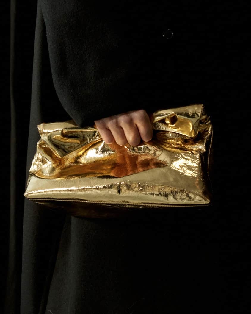 ドリス・ヴァン・ノッテンのインスタグラム：「AUTUMN WINTER 2023 ACCESSORIES  Gold nappa leather clutch.  #DriesVanNoten #DVNAW23」