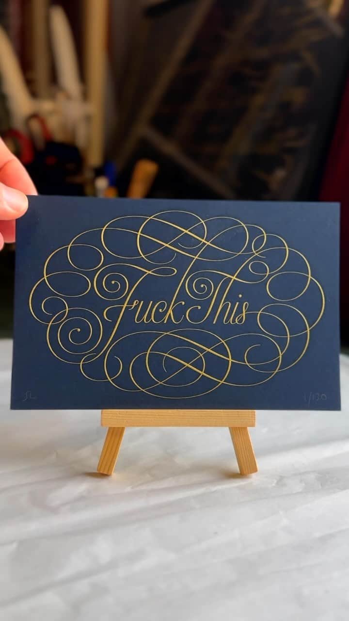 Seb Lesterのインスタグラム：「Launching Thursday 30th November at 5pm GMT (8 am PT /Noon ET), my ‘Pretty Rude’ mini-print in Gold on Midnight Blue, edition of 130 and ‘Astra’ in Gold on Midnight Blue, edition of 180. Details at seblester.com/news, link in profile. These are the last colourways I have of both prints. The black version of ‘Pretty Rude’ sold out in a couple of hours last month. I want to release these this week because my shop is pretty empty and Christmas fast approaches. #seblester #limited edition #art #print #diestamping #gold #calligraphy #lettering #formalscript #englishroundhand」
