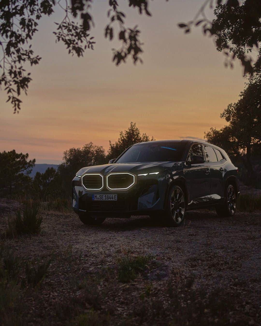BMWのインスタグラム：「Always aim for the next peak. ⛰️ The BMW XM. #BMWXM #BMW #BMWM #MHybrid #MPower  __ BMW XM 50e: Combined fuel consumption, weighted: 1.7–1.3 l/100 km. Combined power consumption, weighted: 32.2–31.5 kWh/100 km. Combined CO2 emissions, weighted: 37–30 g/km. Electric range: 32–33 kilometers. All data according to WLTP.  Further info: www.bmw.com/disclaimer」