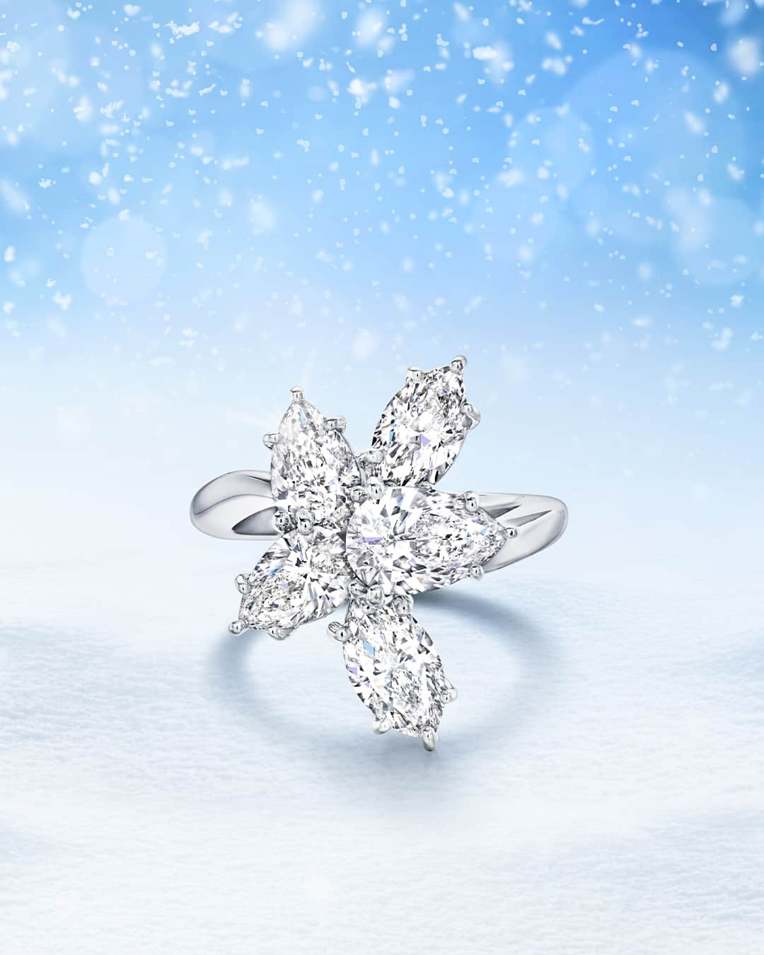 ハリー・ウィンストンのインスタグラム：「Sparkling with pear-shaped and marquise diamonds set on minimal platinum, this Winston Cluster Diamond Ring embodies a snowflake gracefully falling from a winter sky. Accent your hand with a timeless jewel by tapping the link in bio. #WinstonCluster #HarryWinston」