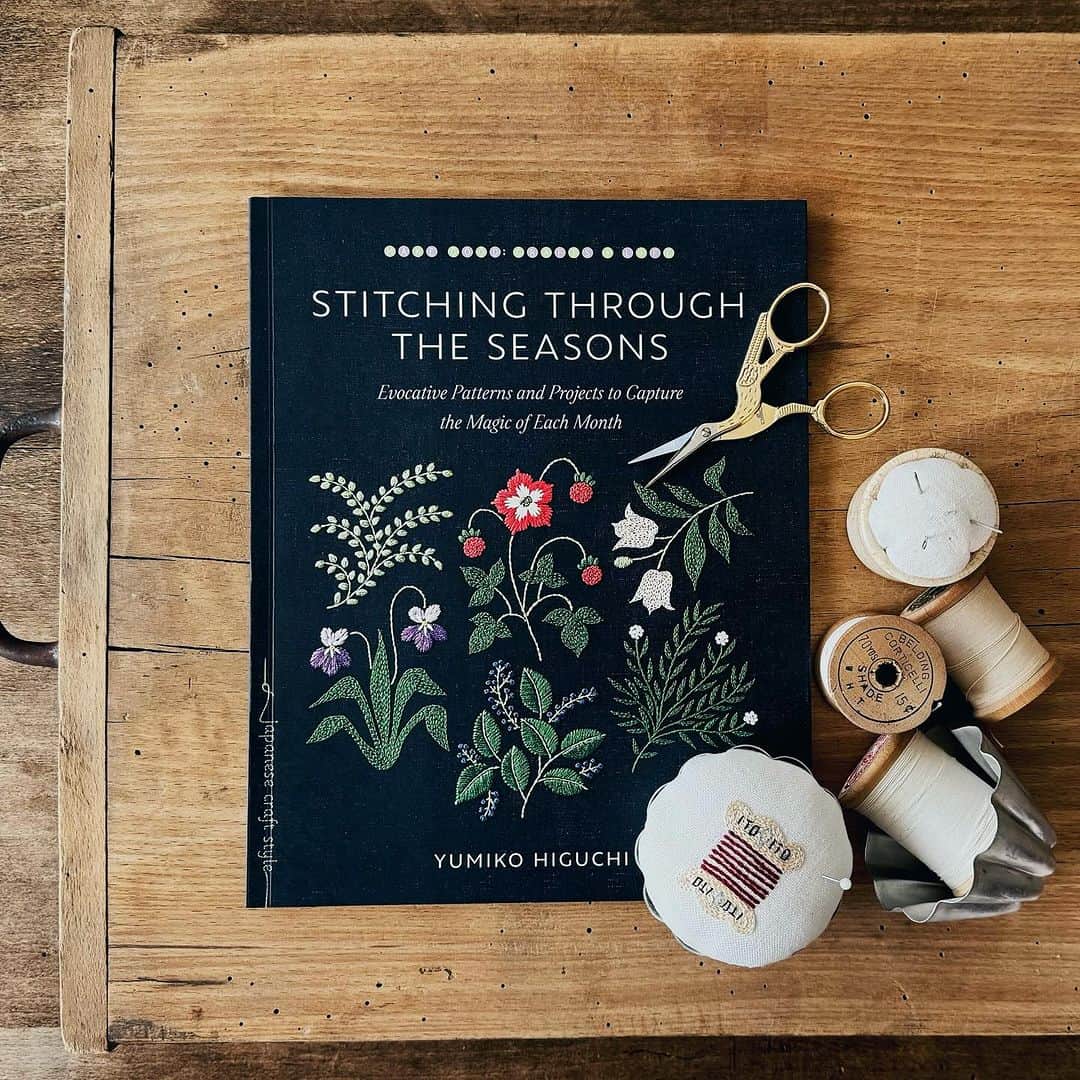 樋口愉美子のインスタグラム：「📖 英語圏の方々お待たせしました。 On sale! 🆕English translation book 『STITCING THROUGH THE SEASONS』yumiko higuchi @roostbooks   Beautiful guided stitchwork for every season—featuring fall pumpkins and mushroom wreaths, winter skiers, spring blossoms, summer vegetables, and more!  日本で2020年発売された『#季節のステッチ』が英語版になってようやく登場。翻訳するのはとても時間がかかりますね。そのぶん素敵に仕上げてくださいましたよ！英語圏の方々にも刺繍沼にハマっていただけますように。  #stitchingthroughtheseasons #yumikoHiguchi #embroidery #roostbooks #embroideryart #embroiderydesign #embroiderersofinstagram #shambhalapublications #stitching #patterns #embroiderypatterns #seasons #holidaygifts #crafting #diy #stitchwork #sewing #creativity」