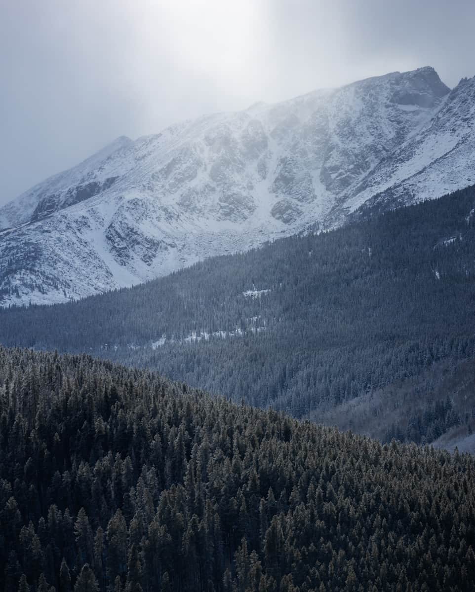 National Geographic Travelのインスタグラム：「Photo by @emilypolar | I was out photographing what was left of the fall color in Colorado when I noticed this channel of light in the falling snow. Not one aspen in sight still held its yellow leaves. Winter was coming, if not here already.   To see more landscapes in the west and east, follow me @emilypolar.」