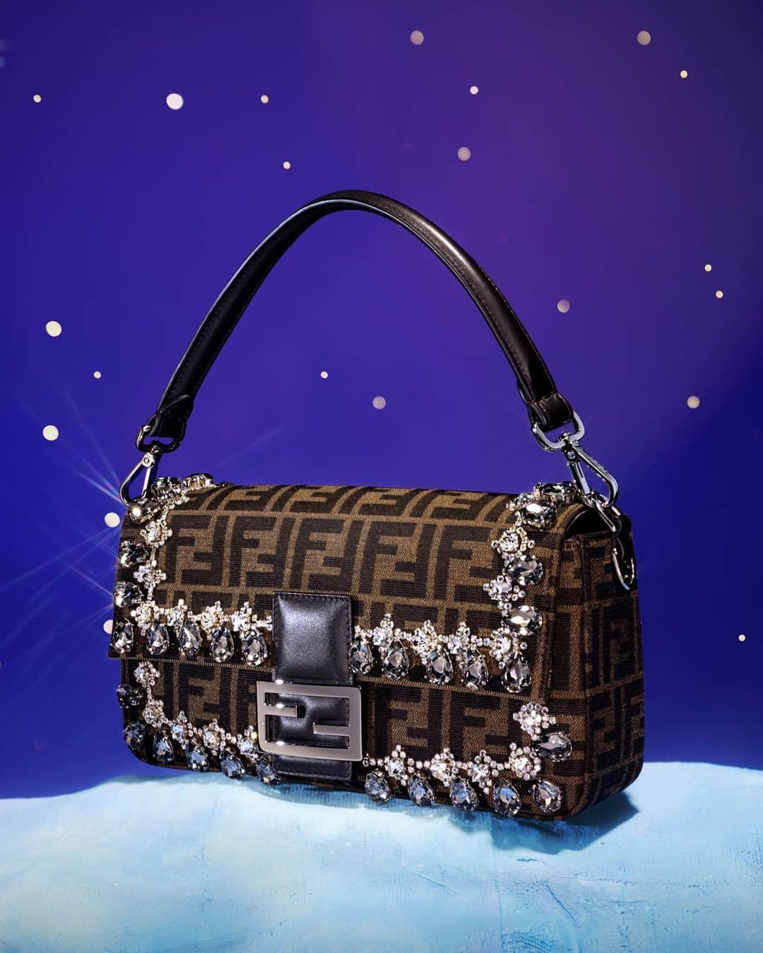 Fendiのインスタグラム：「An iconic gift idea, a crystal-encrusted iteration of the timeless #FendiBaguette.  Shop #FendiGifts in boutiques and at the link in bio.  Photography: @_miloreid_ Set Design: @tilly_power33」