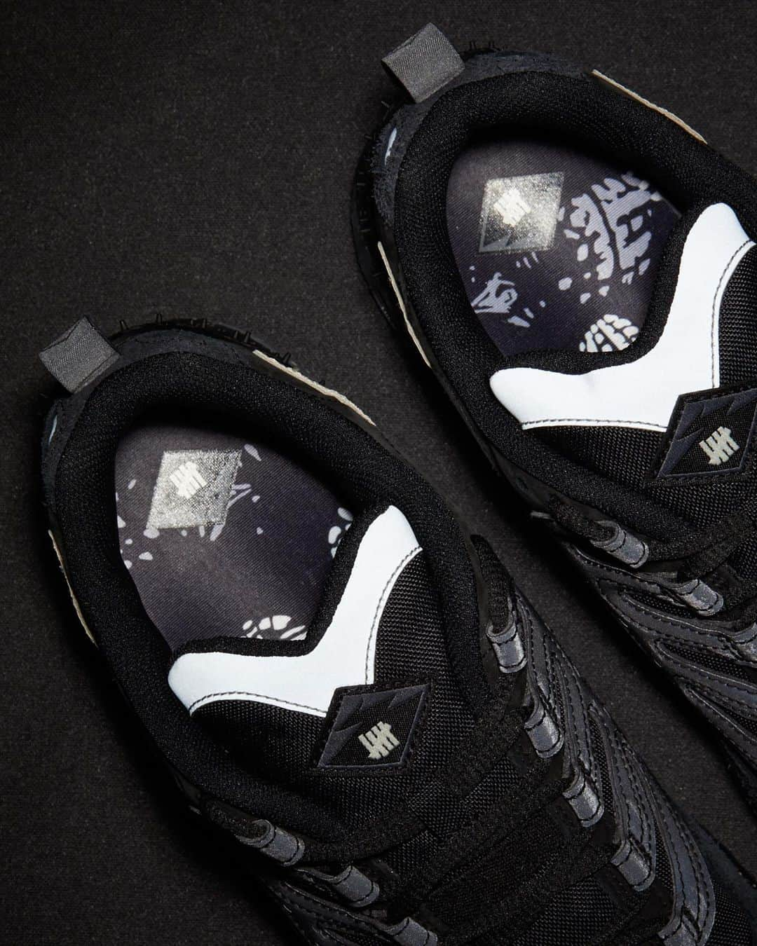 UNDFTDさんのインスタグラム写真 - (UNDFTDInstagram)「UNDEFEATED x Nike Air Terra Humara ‘Black’  Expanding on their long-standing partnership, UNDEFEATED and Nike teamed up in reworking two new iterations of the Air Terra Humara. Both colorways boast a reflective cage that houses a nubuck suede and ballistic cordura upper, sitting atop a speckled rubber midsole, outsole and air bag cage.   Subtle details compliment the shoe’s unique design - the debossed ‘Play Dirty’ lettering split across the medial and lateral sides of the shoe, along with reflective silver elements, the UNDFTD flag label attached to the matte leather Swoosh and a custom graphic sock liner.  Both pairs include an extra set of speckled laces and a custom 5-strike logo reimagined from the original Nike trail branding, a unique logo that appears as a woven label on the tongue and heel and is also showcased on the custom shoe box.  UNDEFEATED Exclusive  The UNDEFEATED x Nike Air Terra Humara in ‘Black’ and ‘Archaeo Brown’ will be available on Saturday, 12/2, exclusively at all UNDEFEATED Chapter Stores globally and Undefeated.com at 8am PST.  Shipping internationally, excluding Korea」12月2日 8時19分 - undefeatedinc