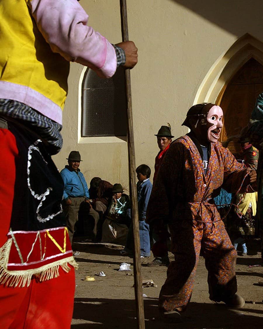 thephotosocietyのインスタグラム：「Photo by @ivankphoto | A man wears a jaguar mask during a Christmas fiesta near Zumbahua, Ecuador, on December 25, 2004. During the fiesta, some wear masks representing different animals as they dance and play-fight.」