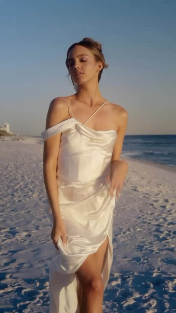 Galia Lahavのインスタグラム：「Capturing the serenity of the final beach sunset before their wedding day, the perfect outfit? ELISE| Bias-cut satin dress, with fully boned corset and silk lining. ✨ Discover similar grace and elegance in Galia Lahav’s Wedding Weekend collection at galialahav.com」