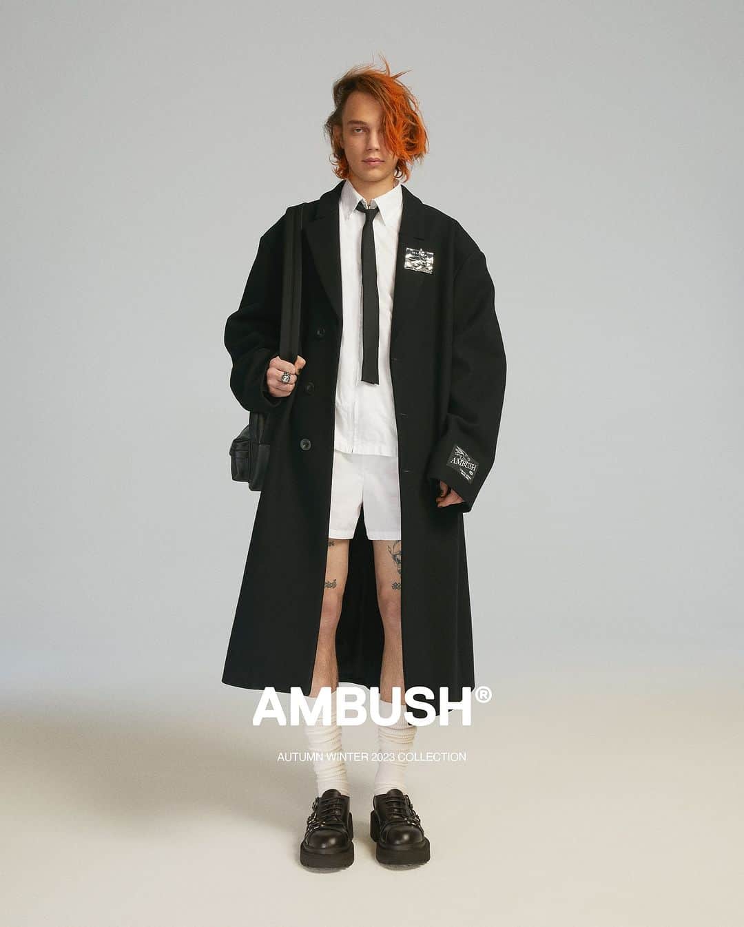 AMBUSHのインスタグラム：「#AMBUSH AW23 COLLECTION LOOK 18  LONG COAT ZIP UP COTTON SHIRT COTTON BOXER TAILORING SLIM NECKTIE PRIVATE SCHOOL SOCKS DETENTION PIN FW23 CLASS RING BACKPACK CROSSBODY  SID LOAFER  New styles at our WEBSHOP and WORKSHOP」